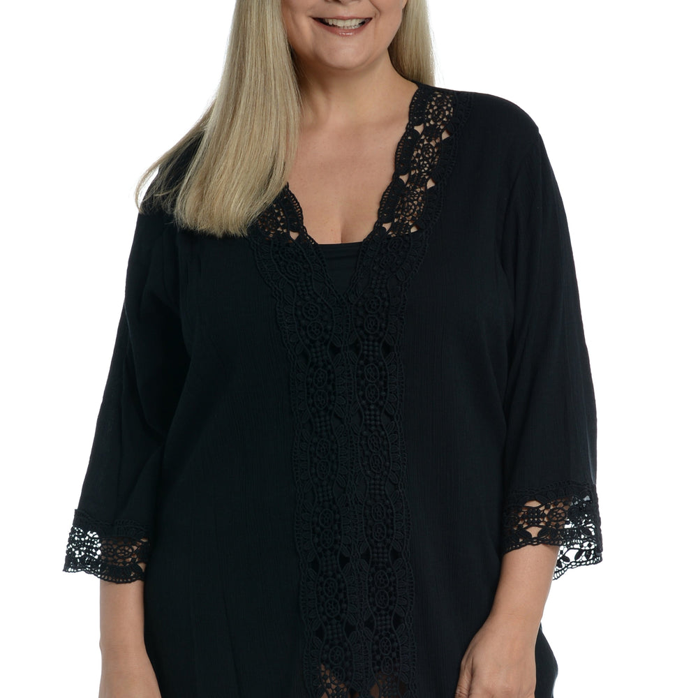 
                  
                    Model is wearing a black v-neck tunic swimsuit cover up from our Island Fare collection.
                  
                