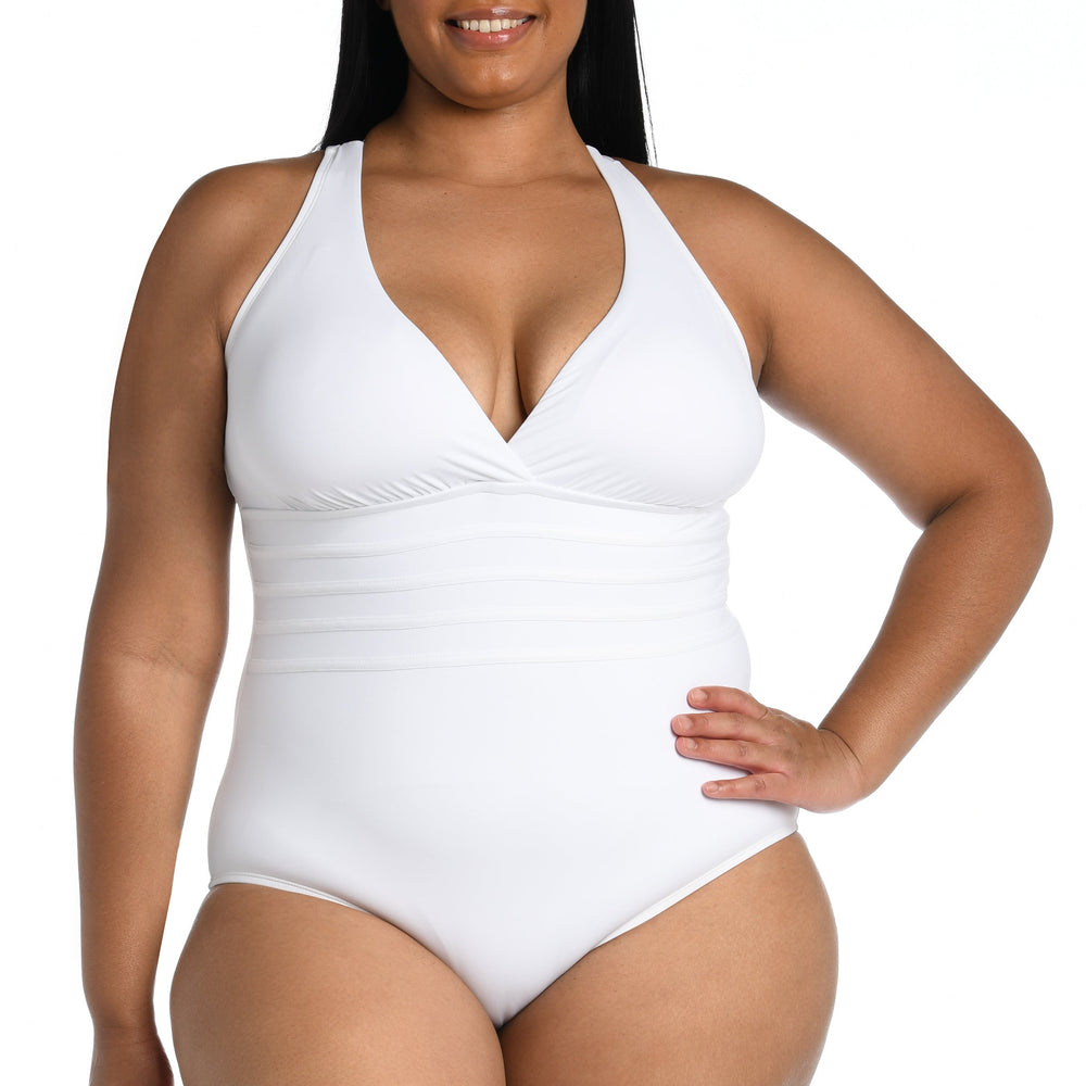 
                  
                    Model is wearing a white one piece swimsuit from our Best-Selling Island Goddess collection.
                  
                