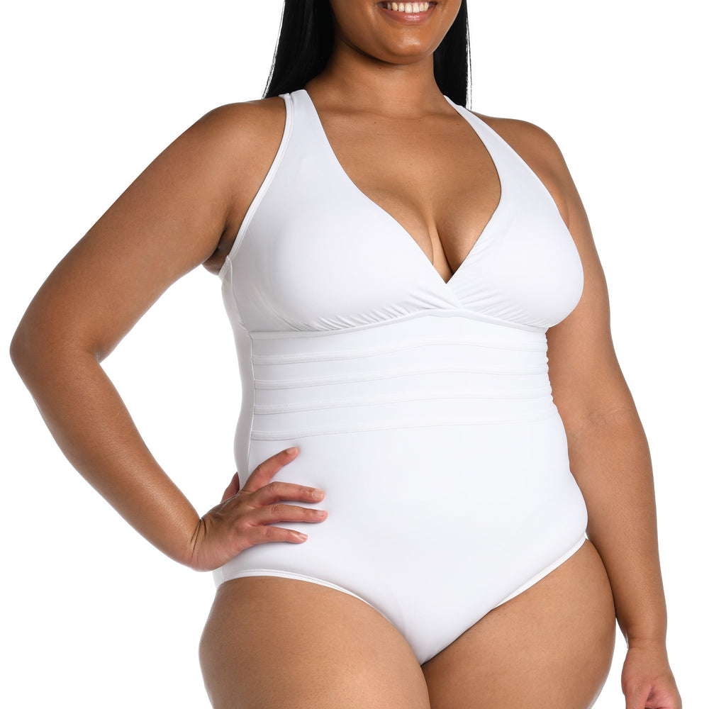 
                  
                    Model is wearing a white one piece swimsuit from our Best-Selling Island Goddess collection.
                  
                