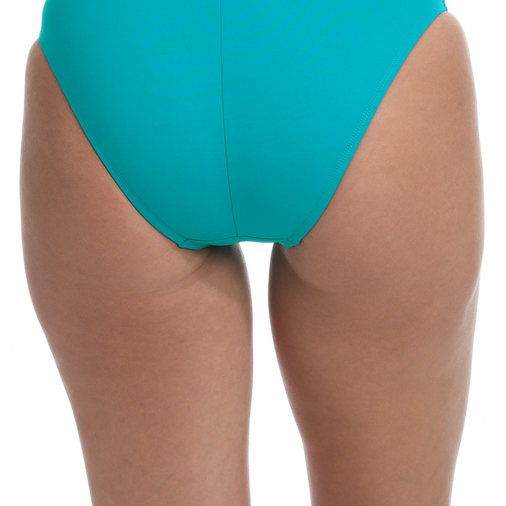 Model is wearing a turquoise colored hipster swimsuit bottom from our Best-Selling Island Goddess collection.