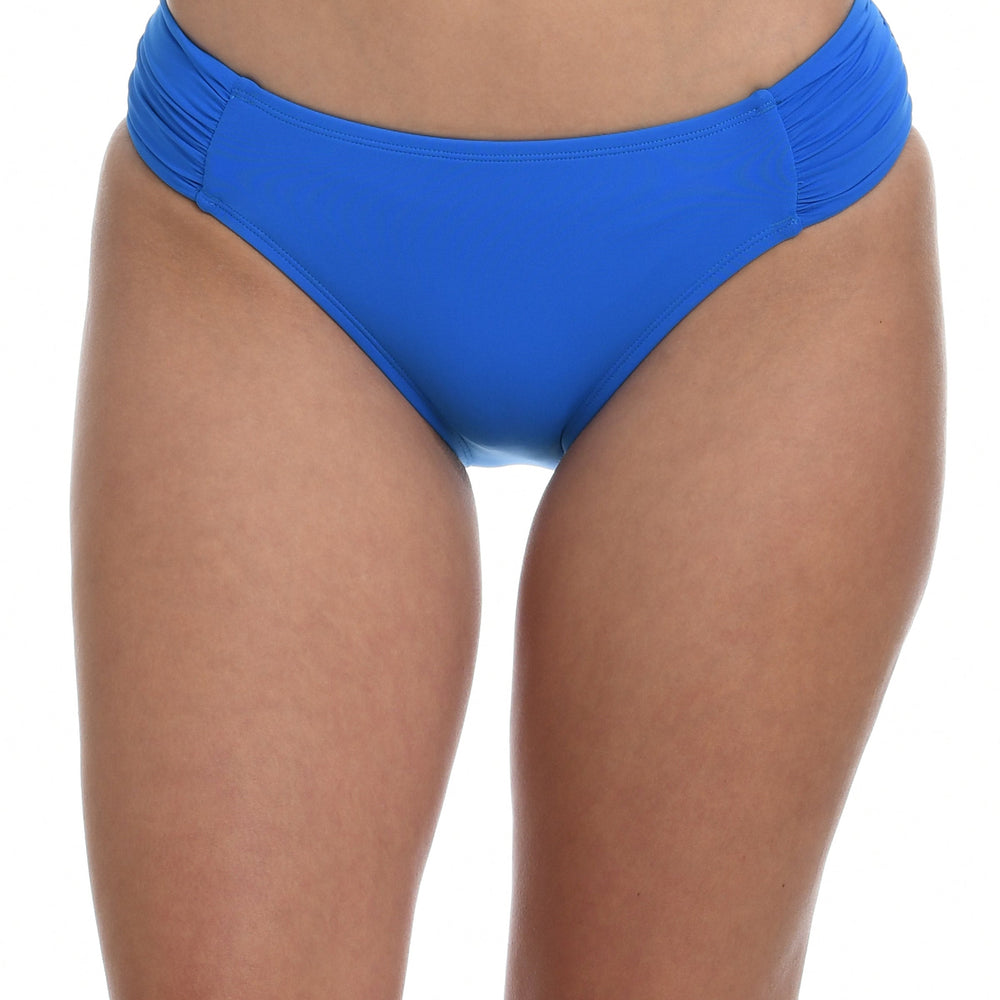 Model is wearing a capri blue colored side-shirred swimsuit bottom from our Best-Selling Island Goddess collection.