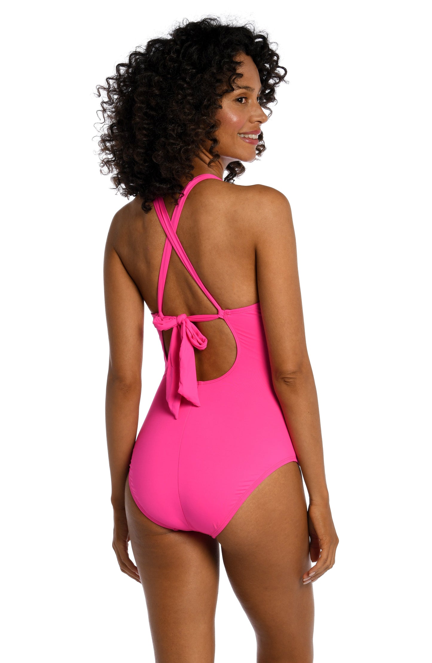 Model is wearing a pop pink colored one piece swimsuit from our Best-Selling Island Goddess collection.