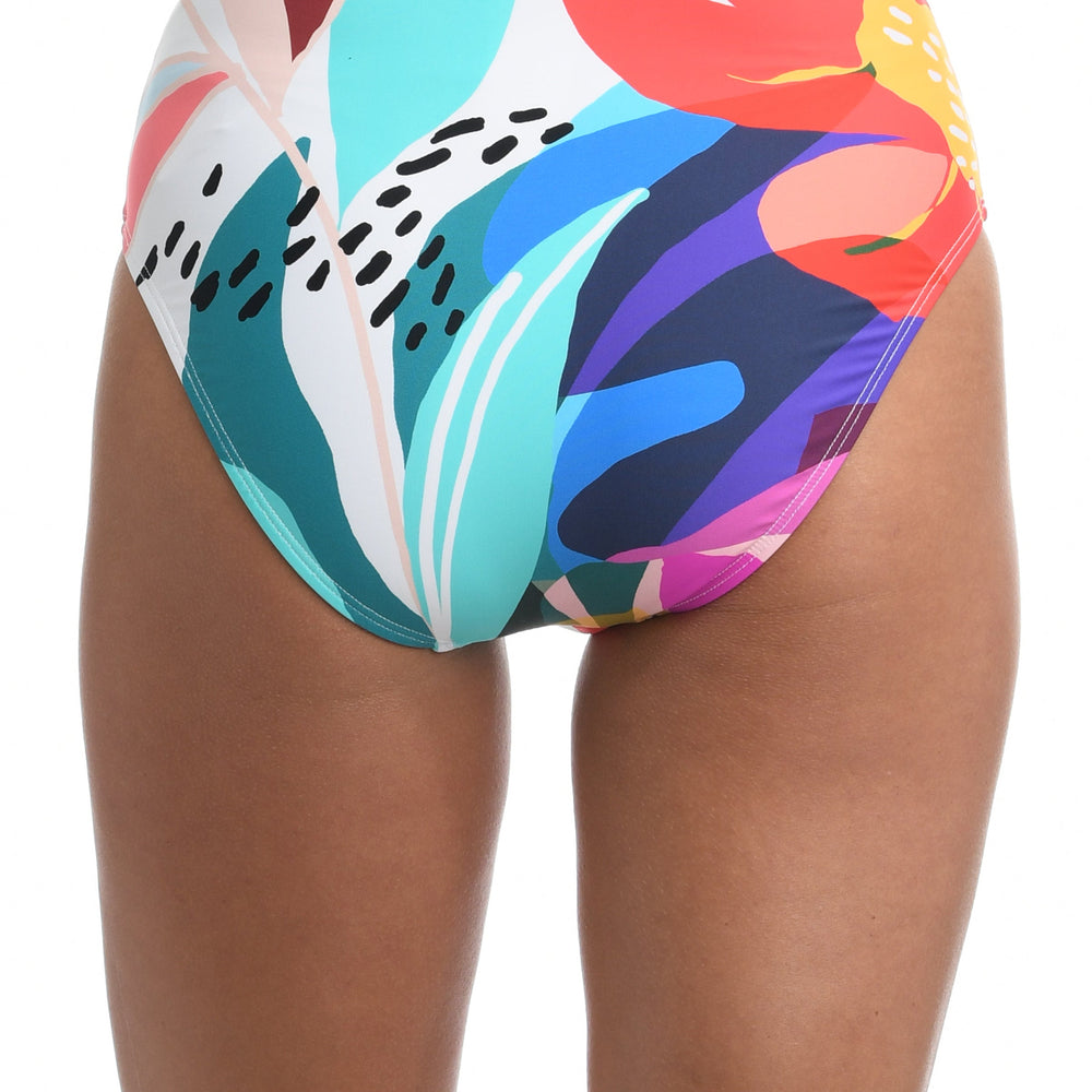 Model is wearing a multi colored tropical printed high waist swimsuit bottom from our Eclectic Shore collection.