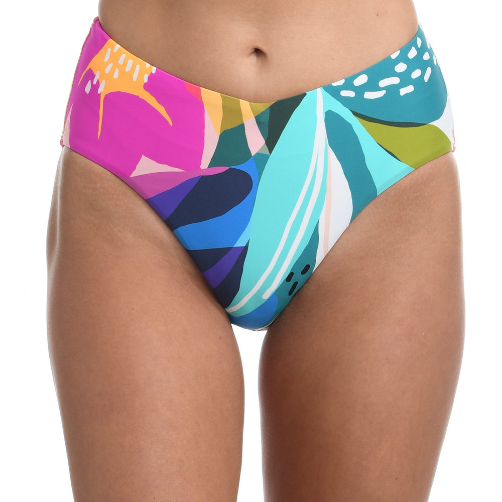 Model is wearing a multi colored tropical printed high waist swimsuit bottom from our Eclectic Shore collection.