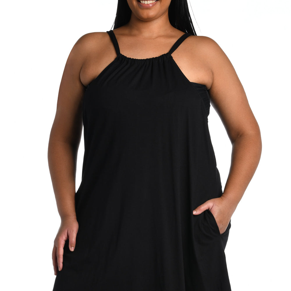 
                  
                    Model is wearing a black mini dress swimsuit cover up from our Draped Darling collection.
                  
                