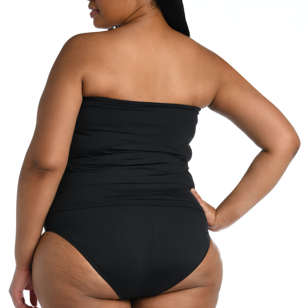 
                  
                    Model is wearing a black bandeau tankini swimsuit top from our Best-Selling Island Goddess collection.
                  
                