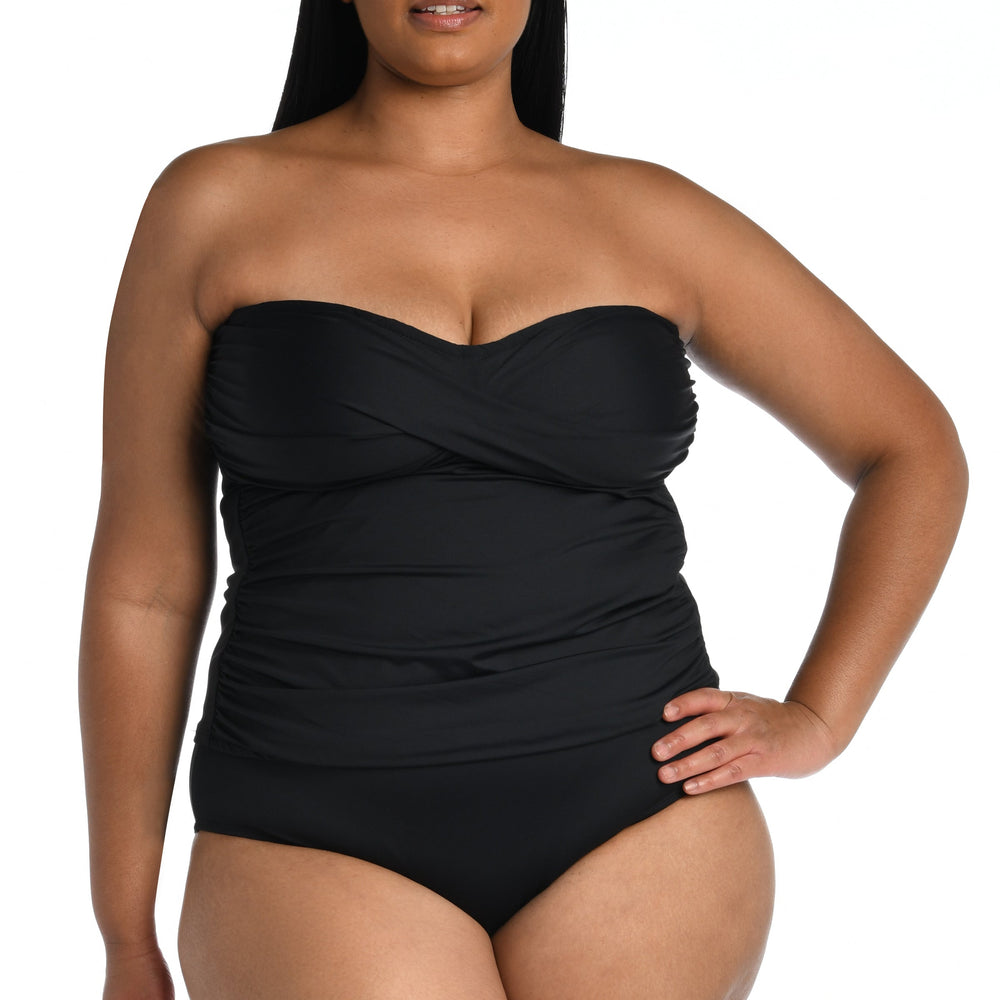 
                  
                    Model is wearing a black bandeau tankini swimsuit top from our Best-Selling Island Goddess collection.
                  
                