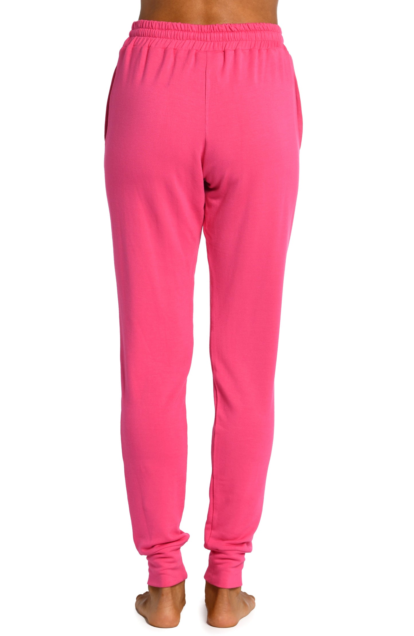 Model is wearing a pop pink colored knitted joggers from our Living in Leisure collection!