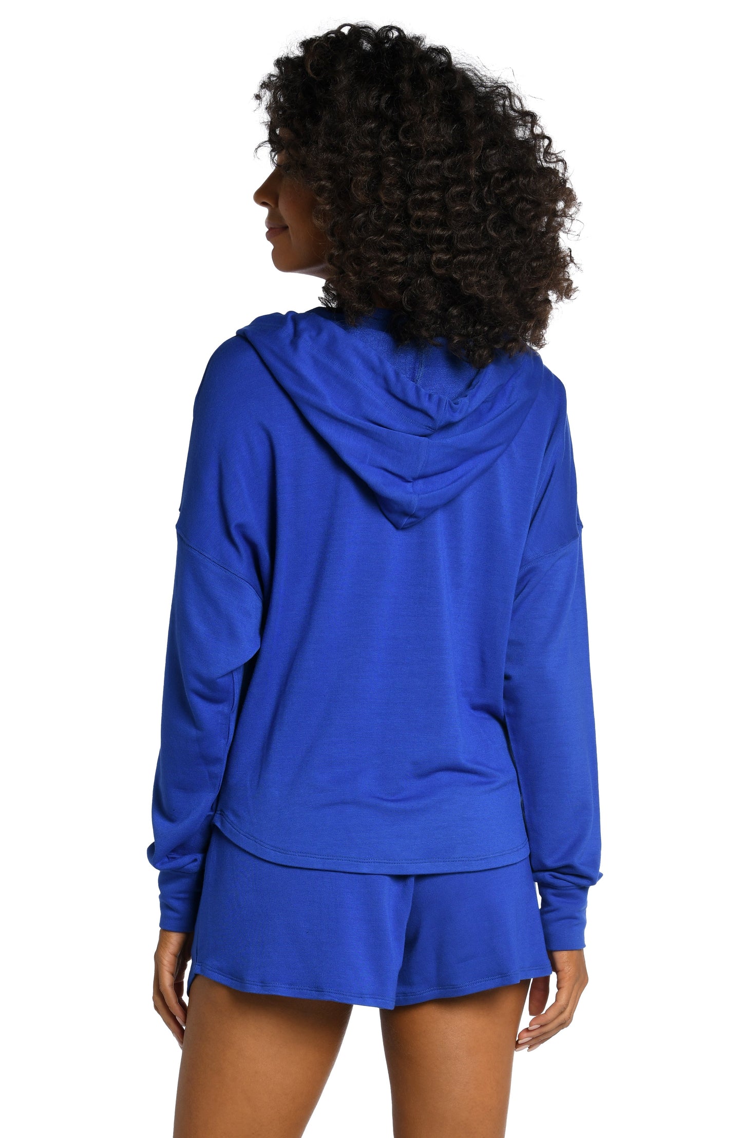 Model is wearing a sapphire colored hooded sweater from our Living in Leisure collection!