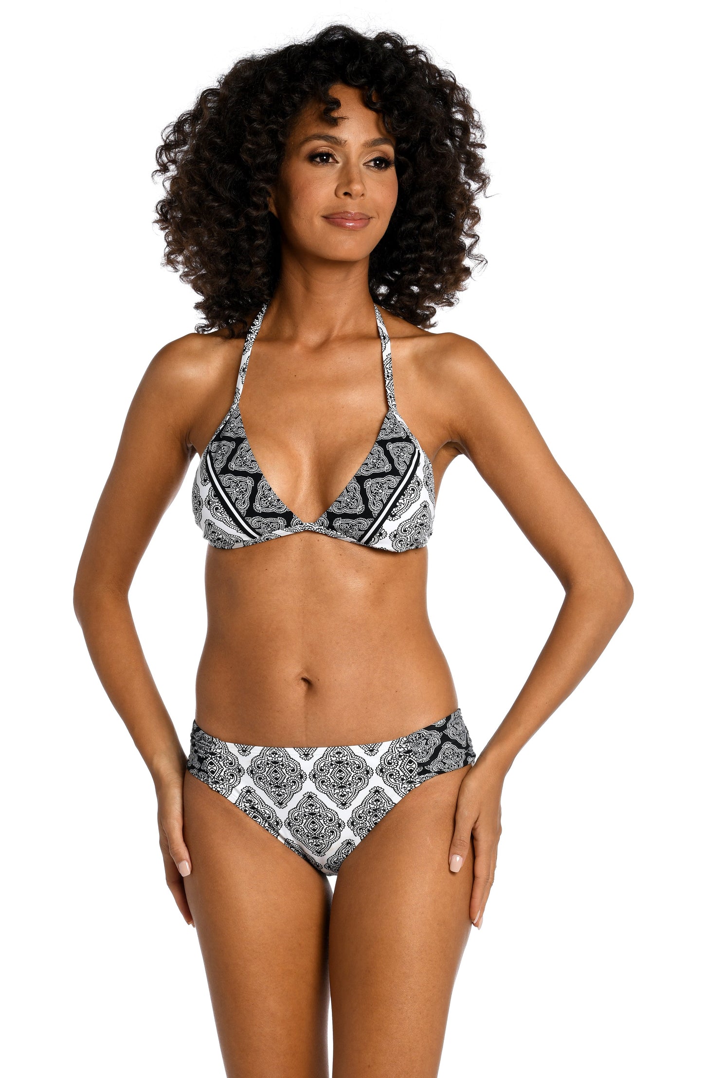 Model is wearing a black and white geometric printed halter triangle top from our Oasis Tile collection!