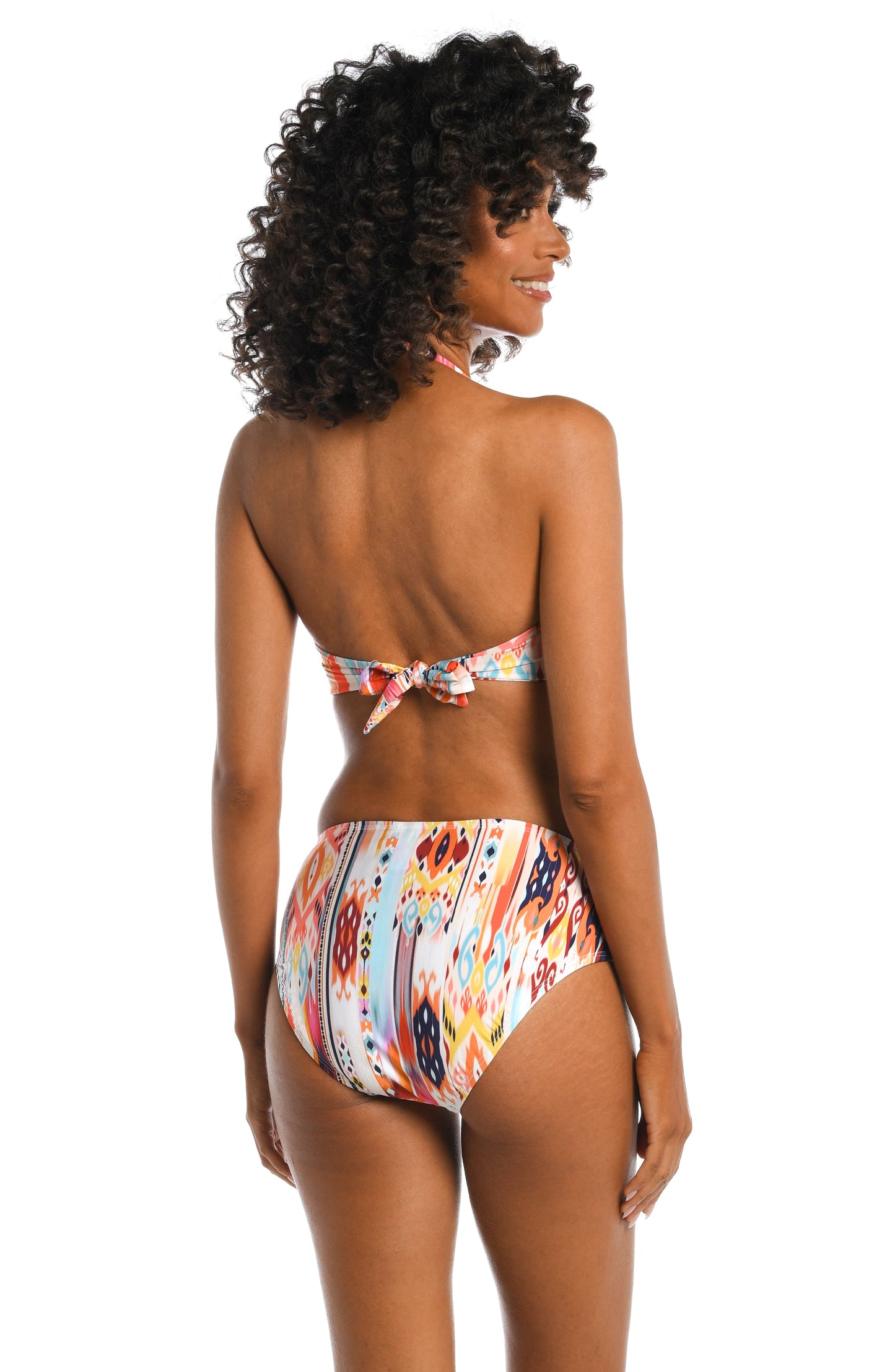 Model is wearing a multi colored tribal printed bandeau top from our Desert Dream collection!