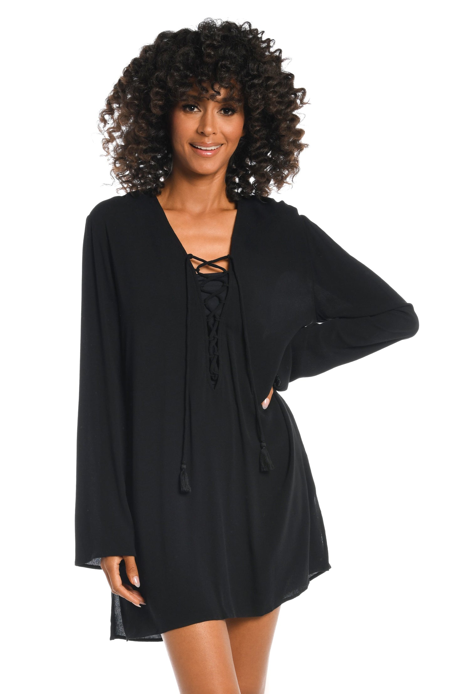 Model is wearing a solid black v-neck tunic over up from our Beachcomber Basics collection!