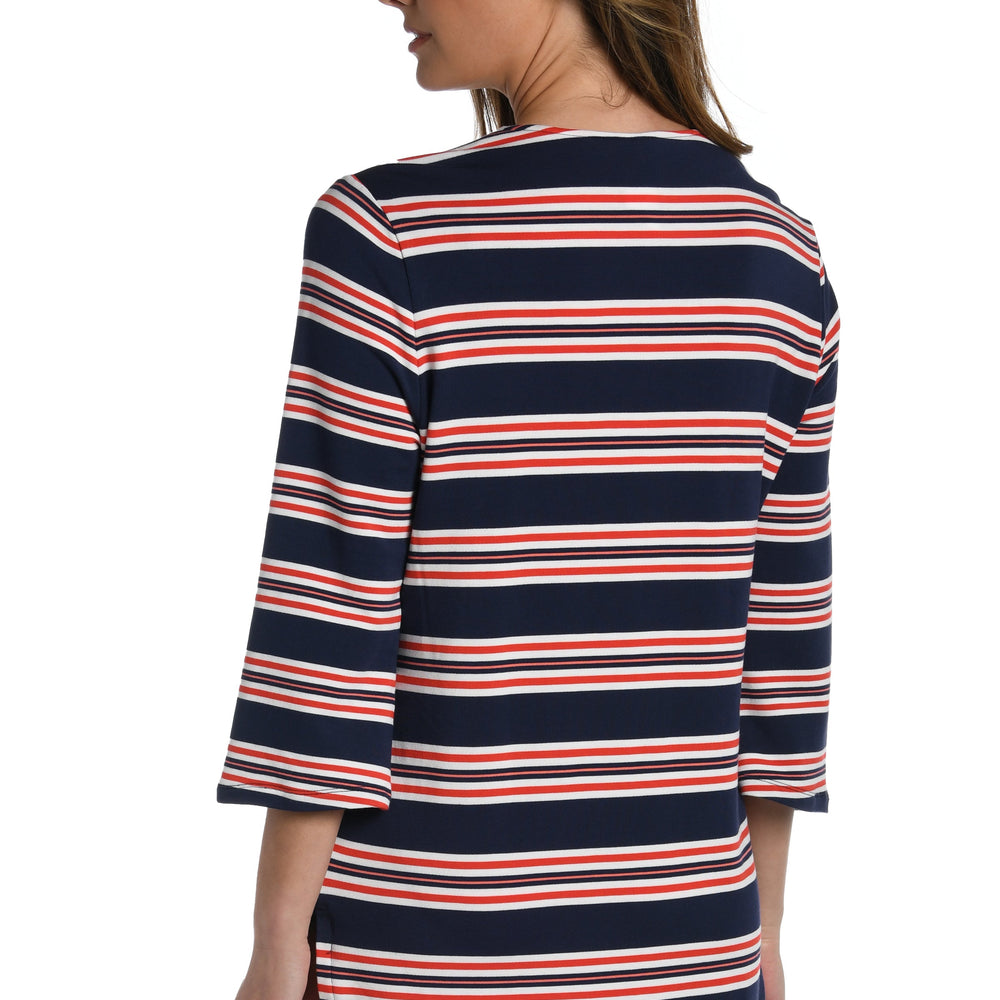 Model is wearing a red, white, and blue striped patterned v-neck tunic from our Sailor Stripe collection!