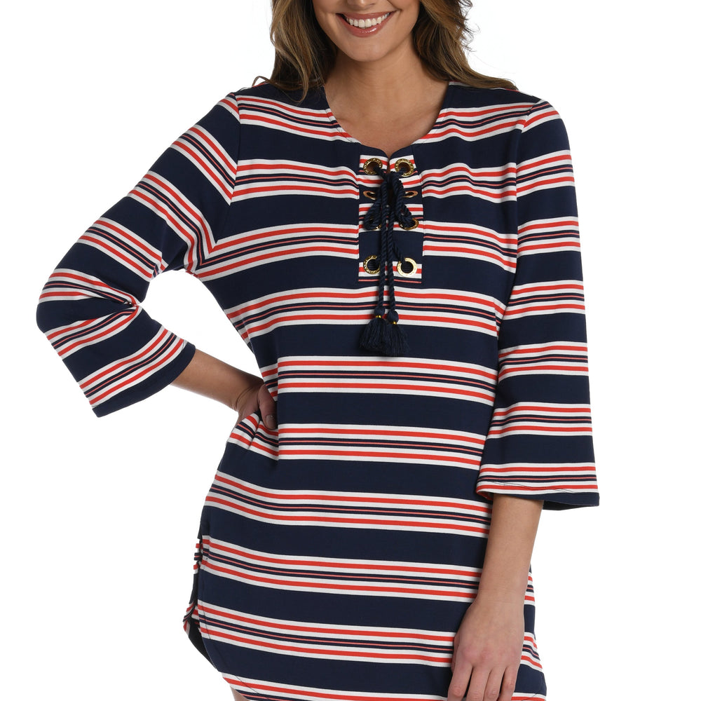 Model is wearing a red, white, and blue striped patterned v-neck tunic from our Sailor Stripe collection!