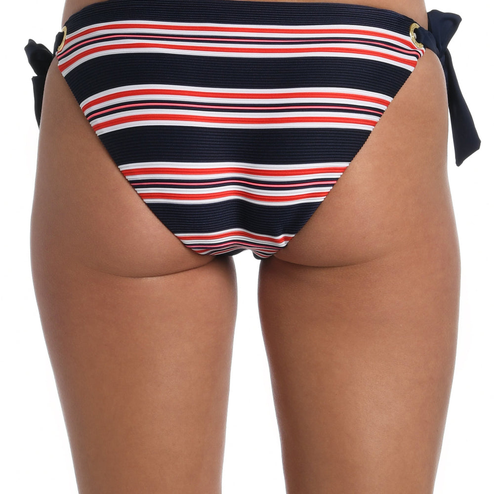 Model is wearing a red, white, and blue striped patterned side tie hipster bottom from our Sailor Stripe collection!