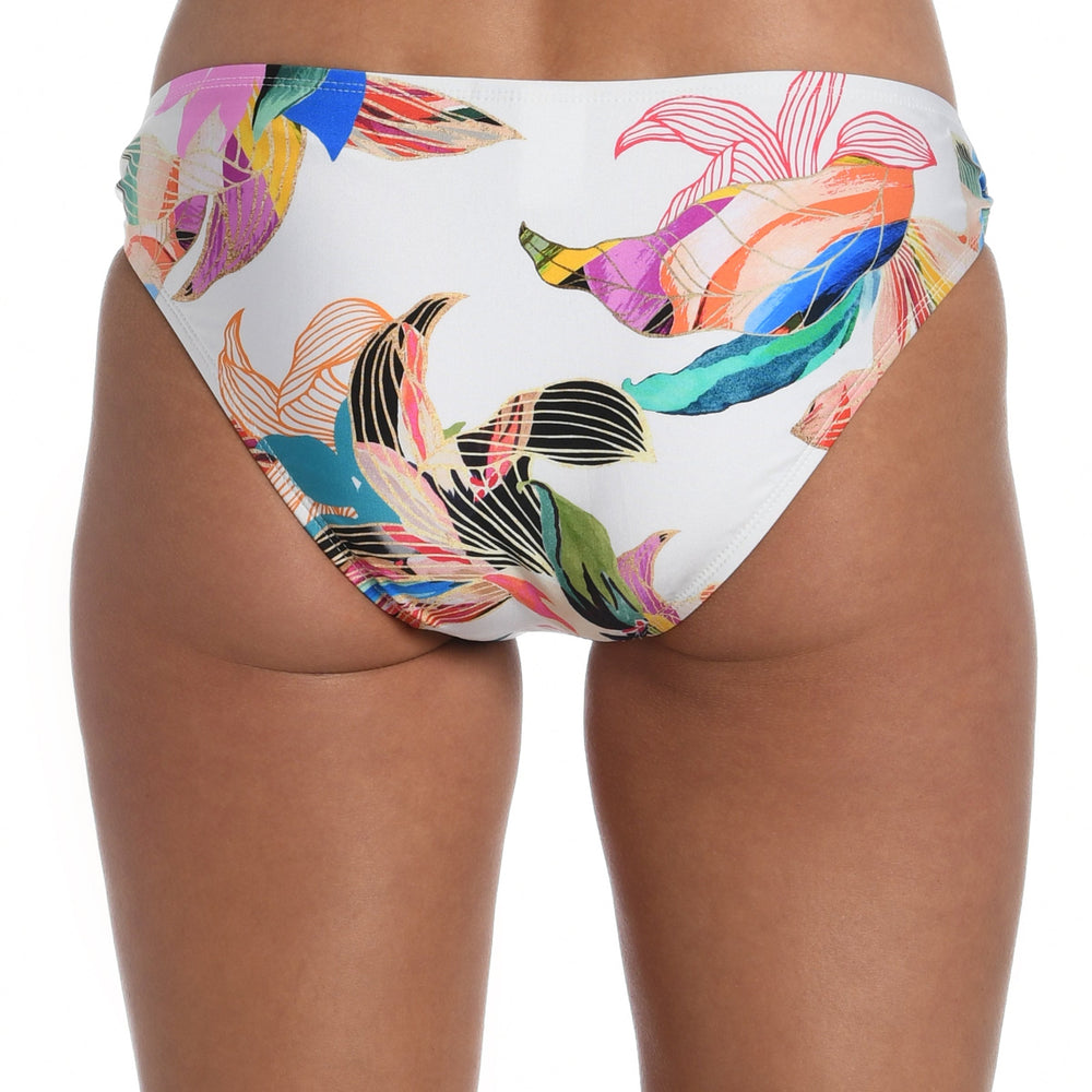 Model is wearing a multi colored tropical printed side tie hipster bottom from our Paradise City collection!