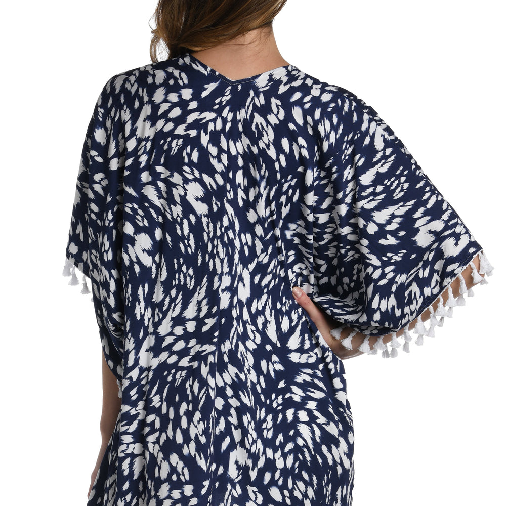 Model is wearing a indigo blue colored print with pops of white on this kimono cover up from our Changing Tides collection!