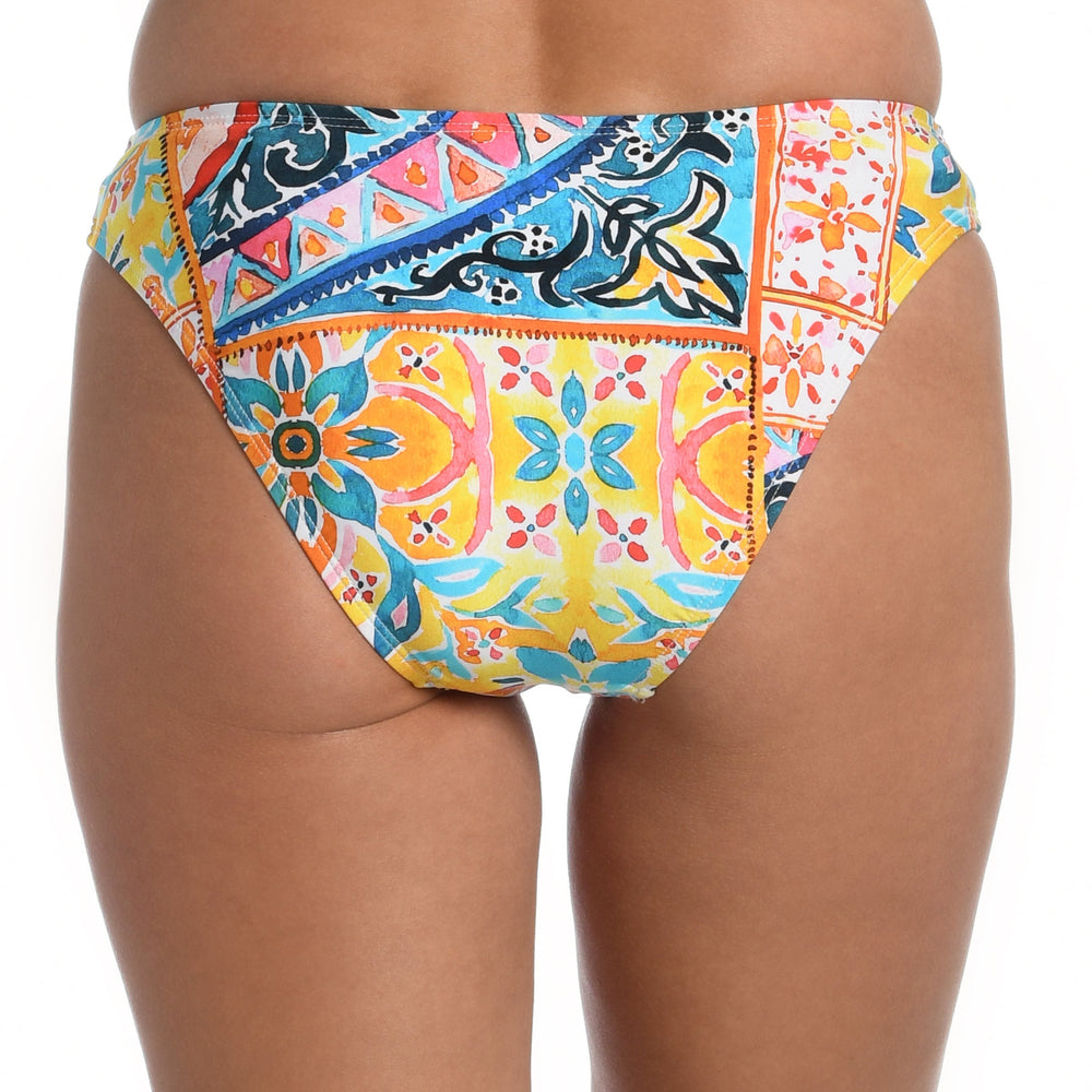 Model is wearing a moroccan inspired multi colored printed hipster bottom from our Soleil collection!