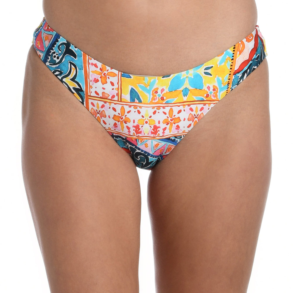 Model is wearing a moroccan inspired multi colored printed hipster bottom from our Soleil collection!