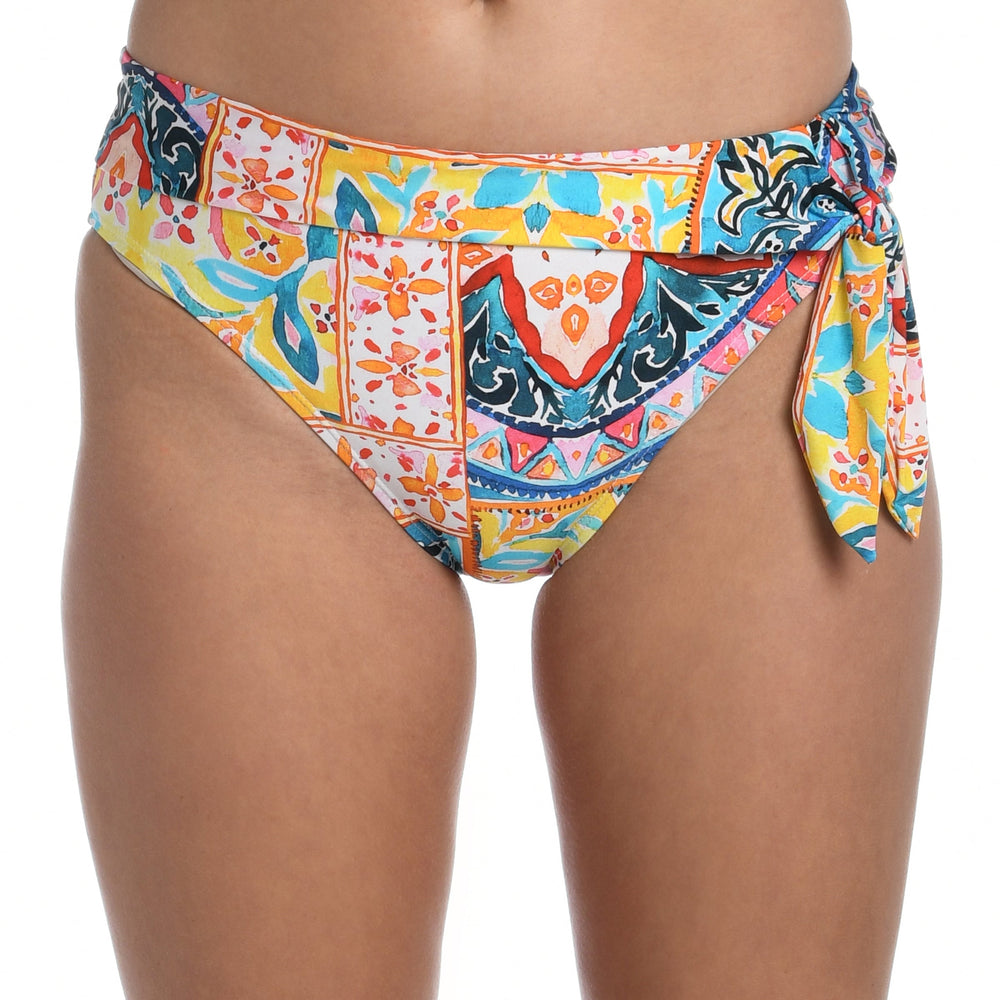 Model is wearing a moroccan inspired multi colored printed high waist bottom from our Soleil collection!