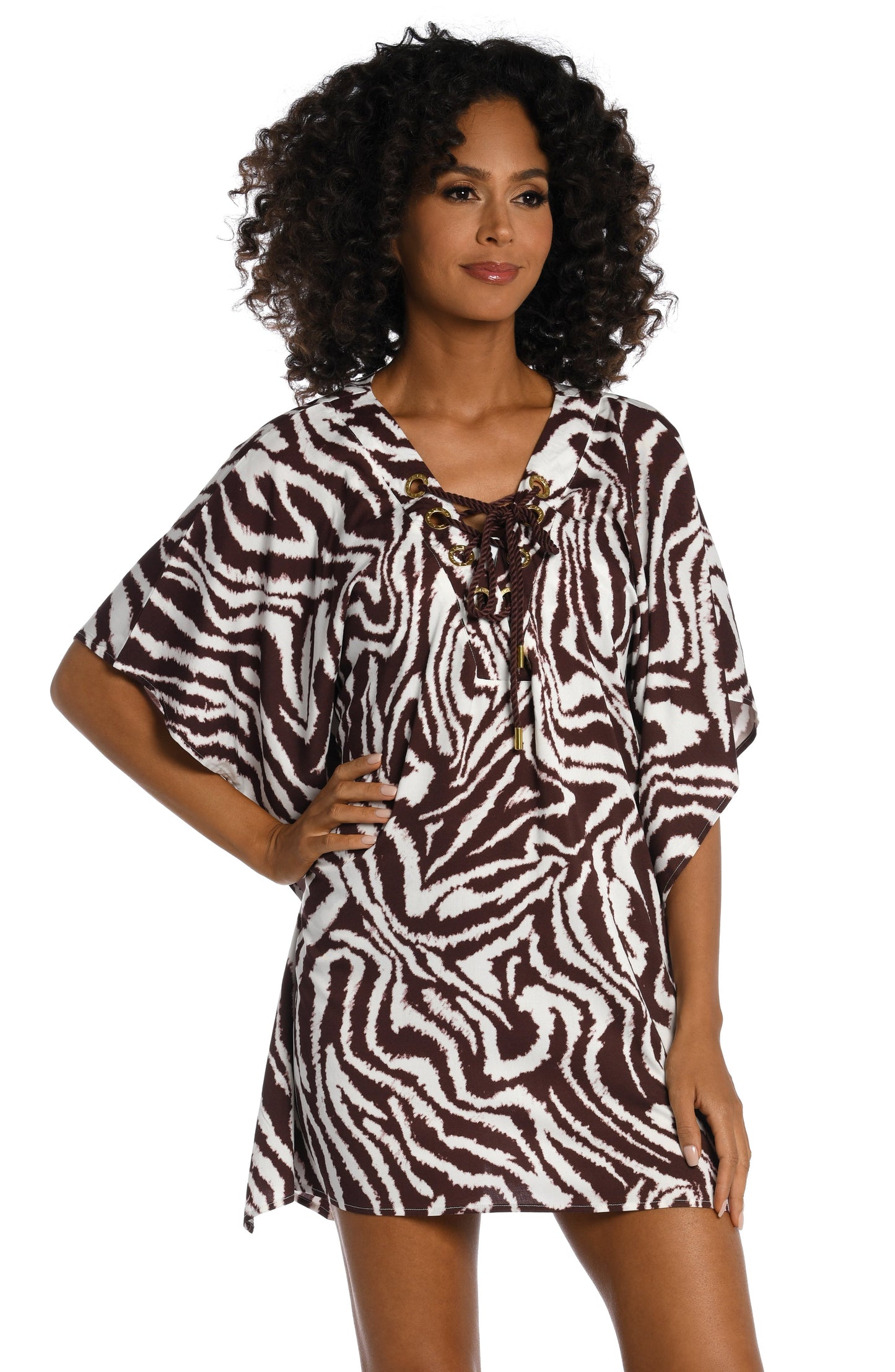 Model is wearing a java colored animal printed v-neck caftan wrap cover up in our Fierce Lines collection!