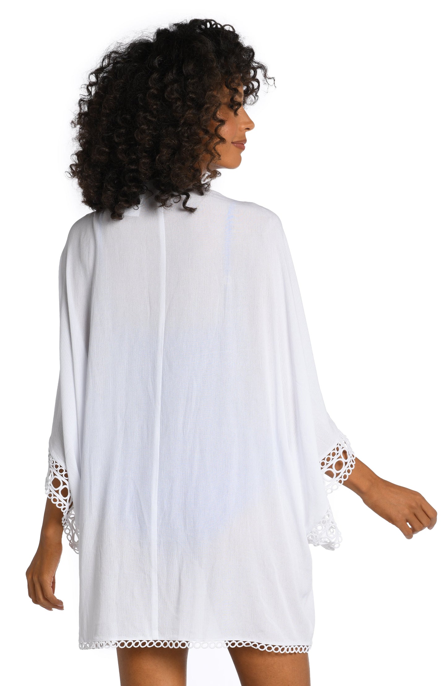 Model is wearing a white colored crochet kimono cover up from our Illusion Covers collection!