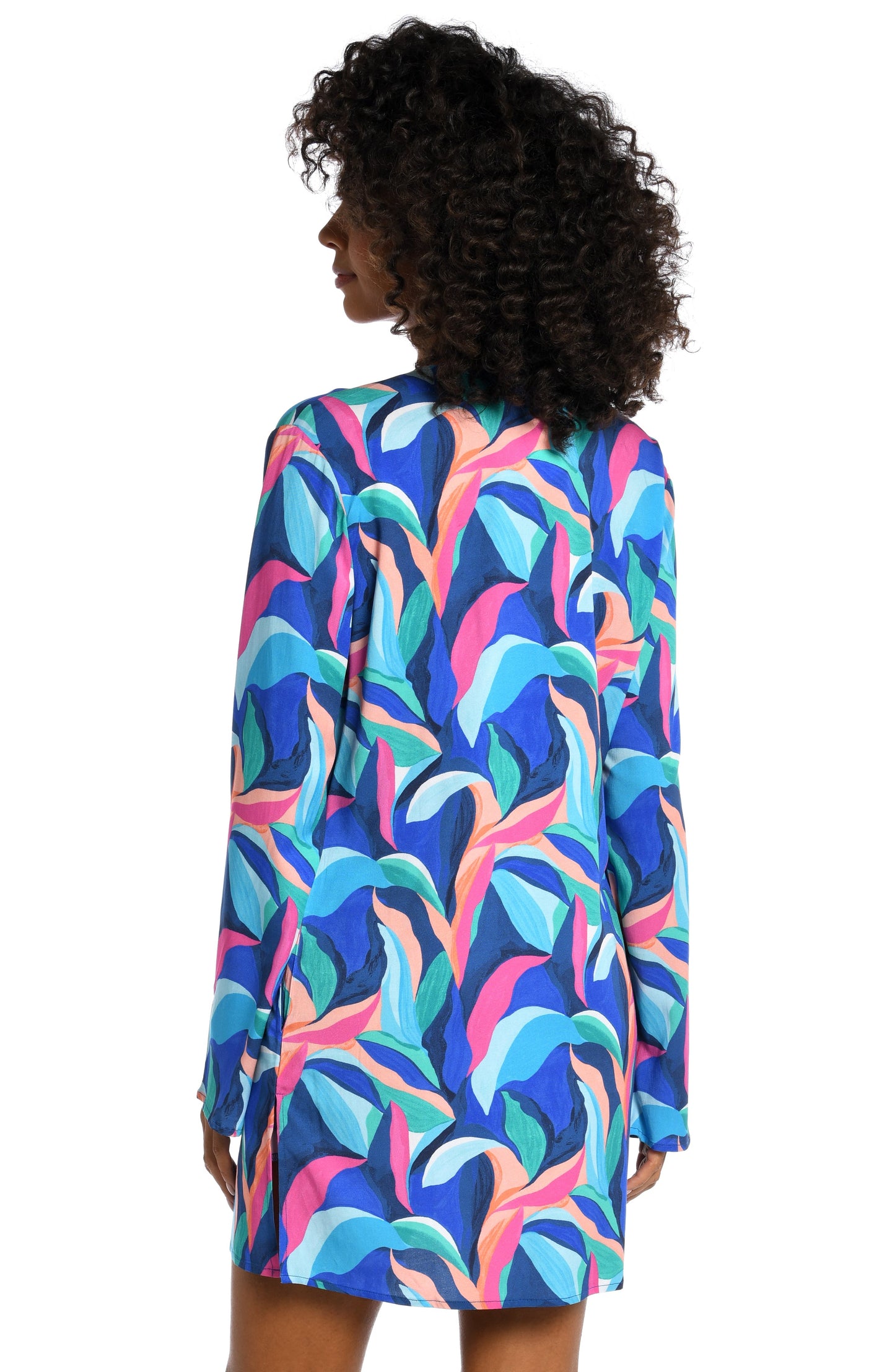 Model is wearing a bold paint-like stroke of vibrant dark colors printed on this v-neck tunic cover up from our Painted Leaves collection!