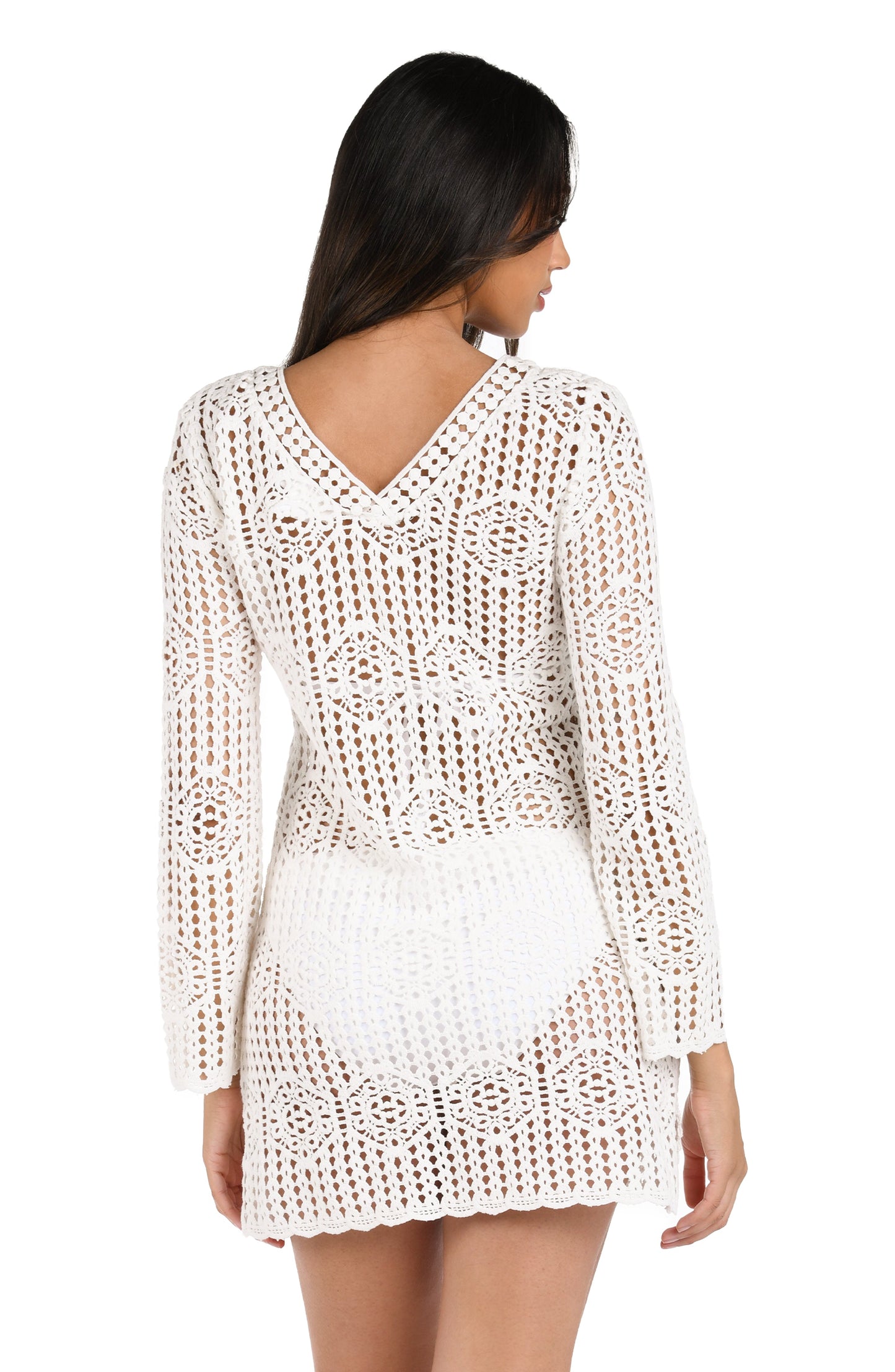 Model is wearing a solid ivory crochet v-neck dress cover up from our Waverly Covers collection.