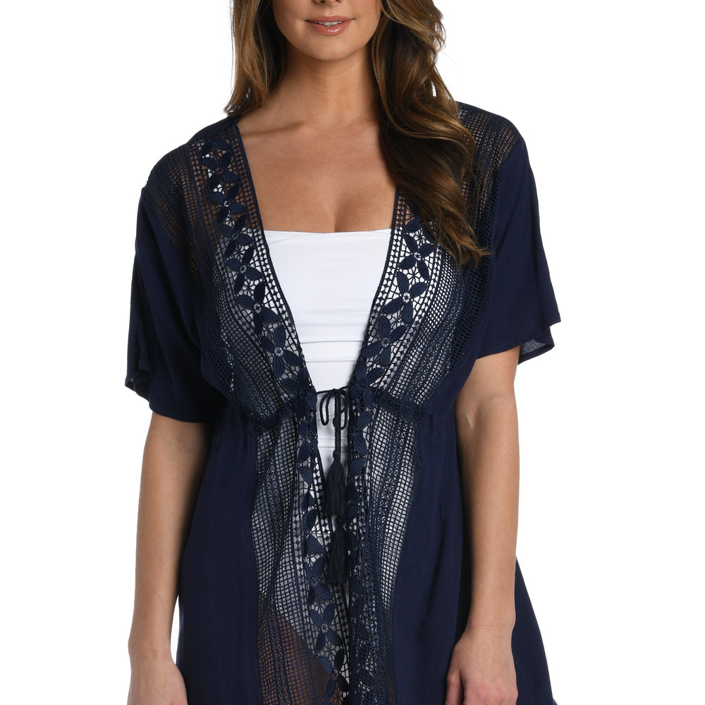 Model is wearing a crochet detailed pattern on this indigo kimono cover up from out Coastal Covers collection!