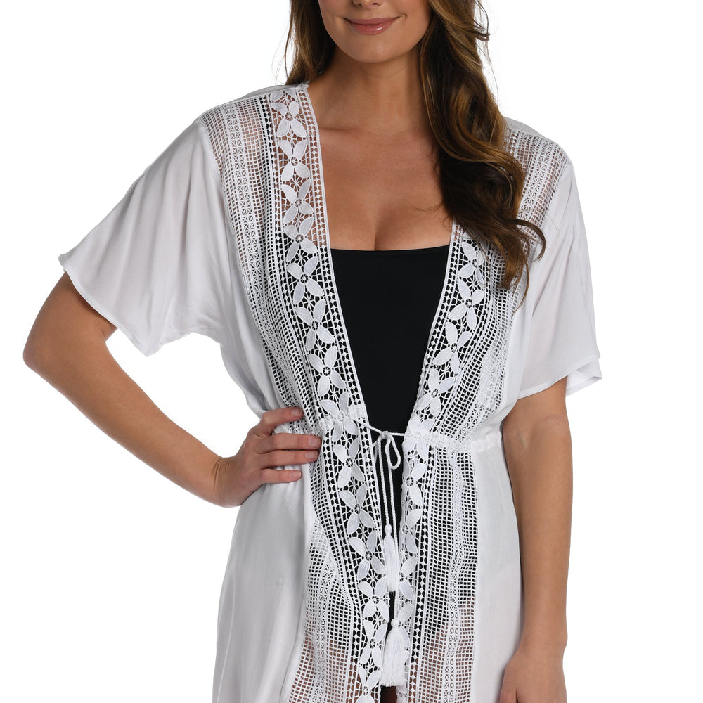 Model is wearing a crochet detailed pattern on this white kimono cover up from out Coastal Covers collection!