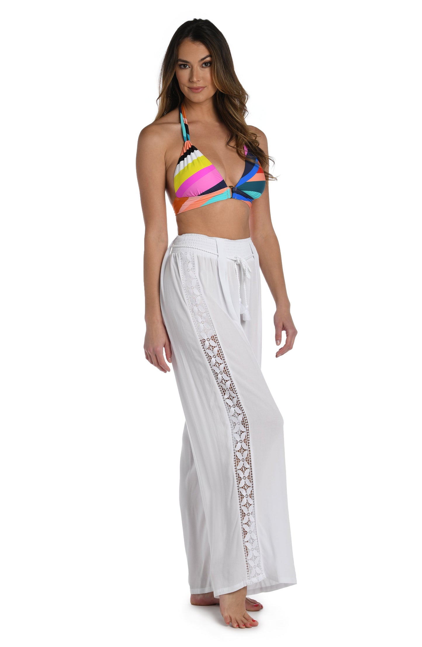 Model is wearing a crochet detailed pattern on this white palazzo pant cover up from out Coastal Covers collection!