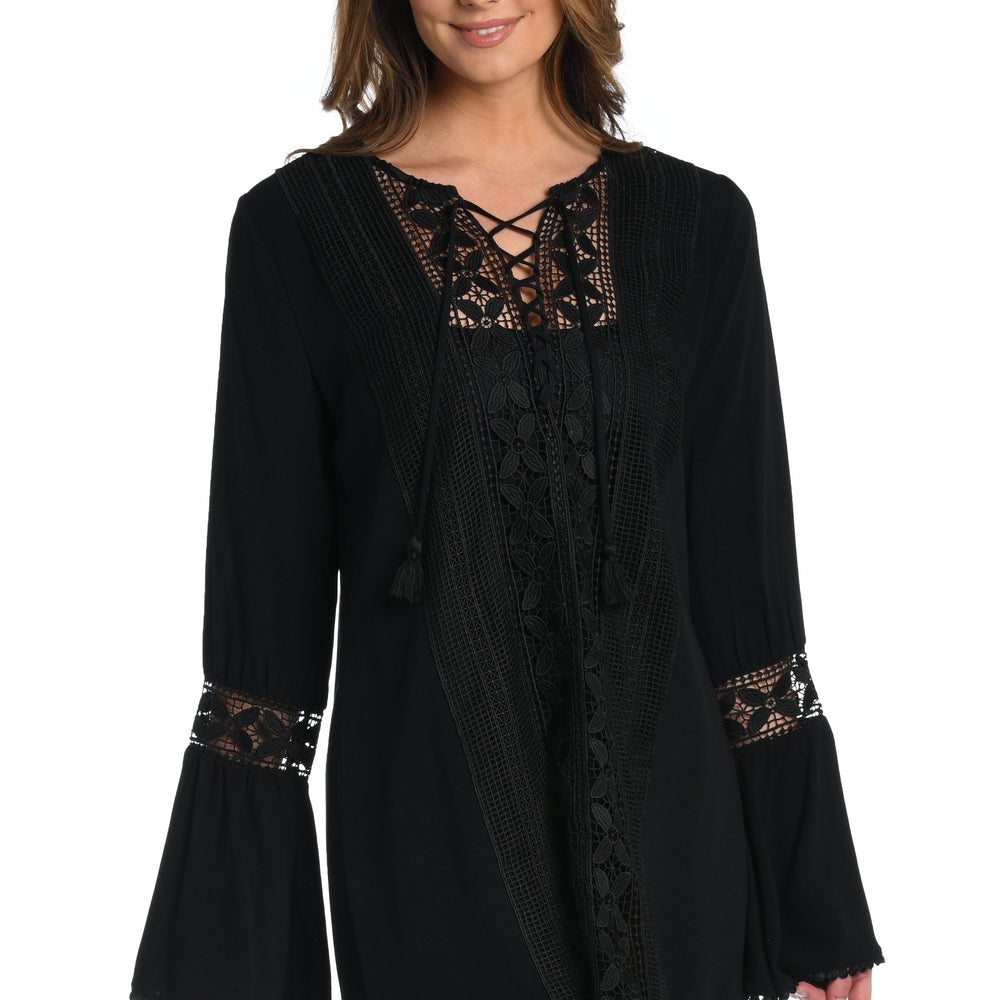 Model is wearing a crochet detailed pattern on this white v-neck tunic cover up from out Coastal Covers collection!