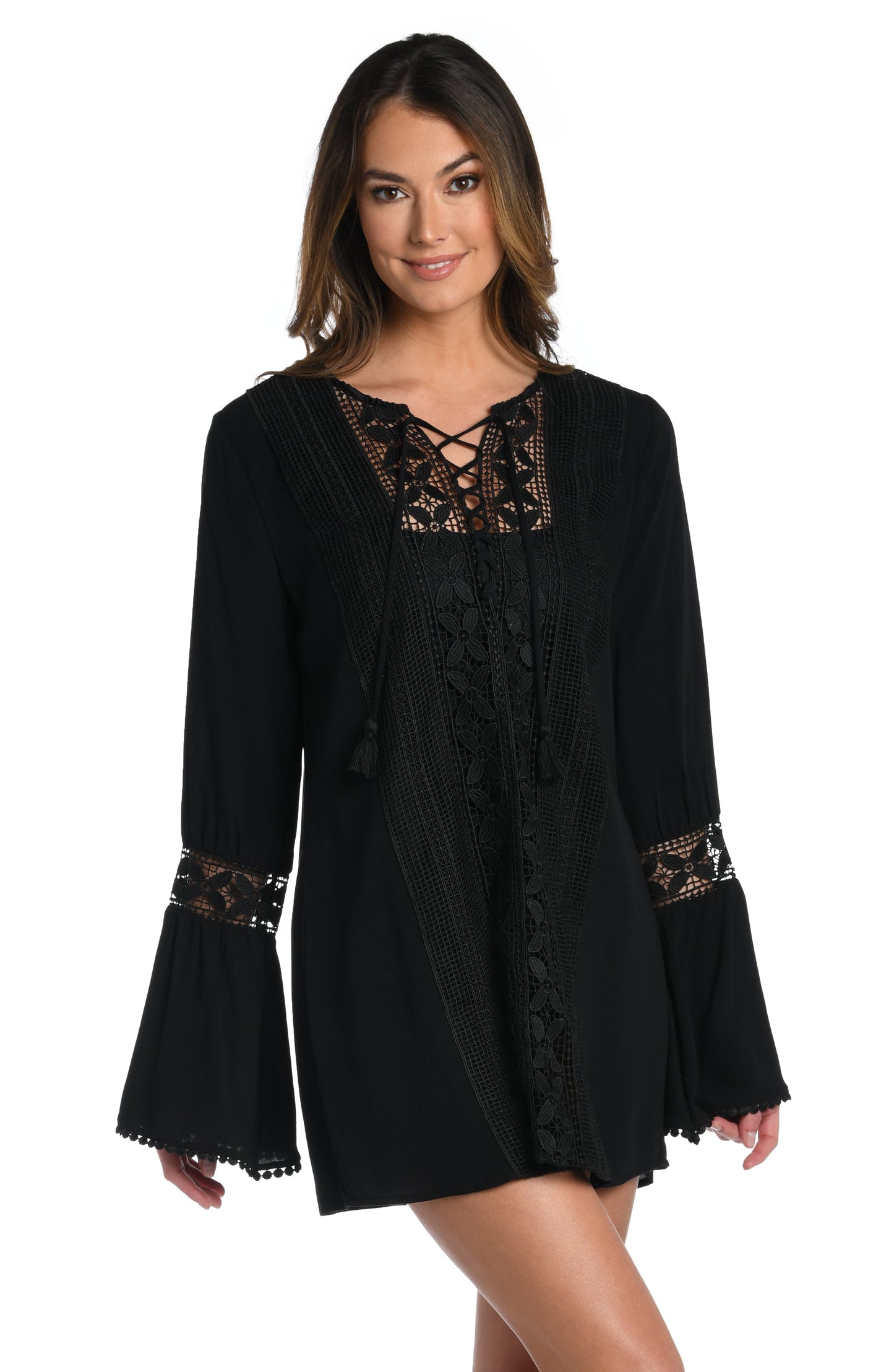 Model is wearing a crochet detailed pattern on this white v-neck tunic cover up from out Coastal Covers collection!