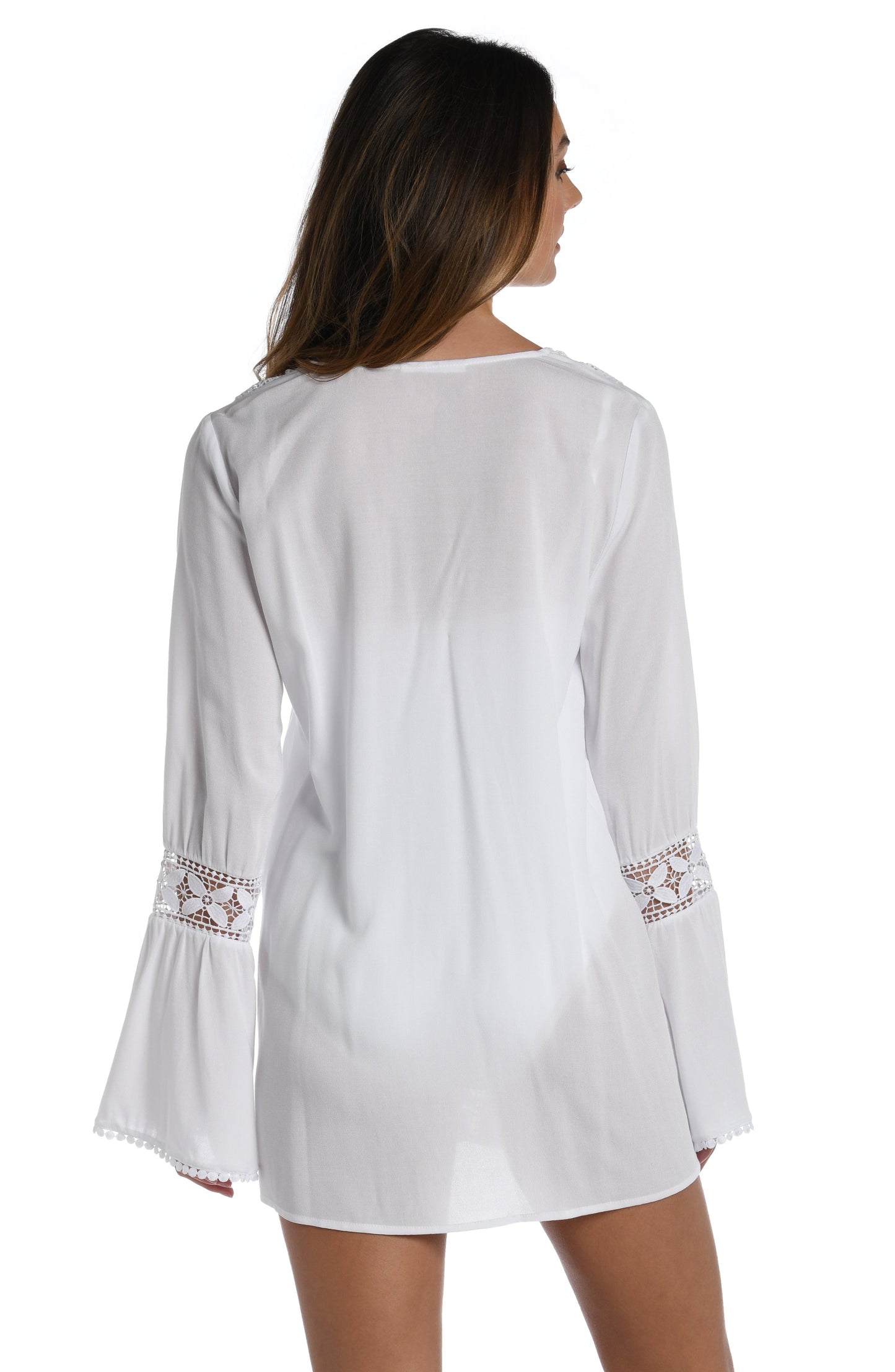 Model is wearing a crochet detailed pattern on this white v-neck tunic cover up from out Coastal Covers collection!