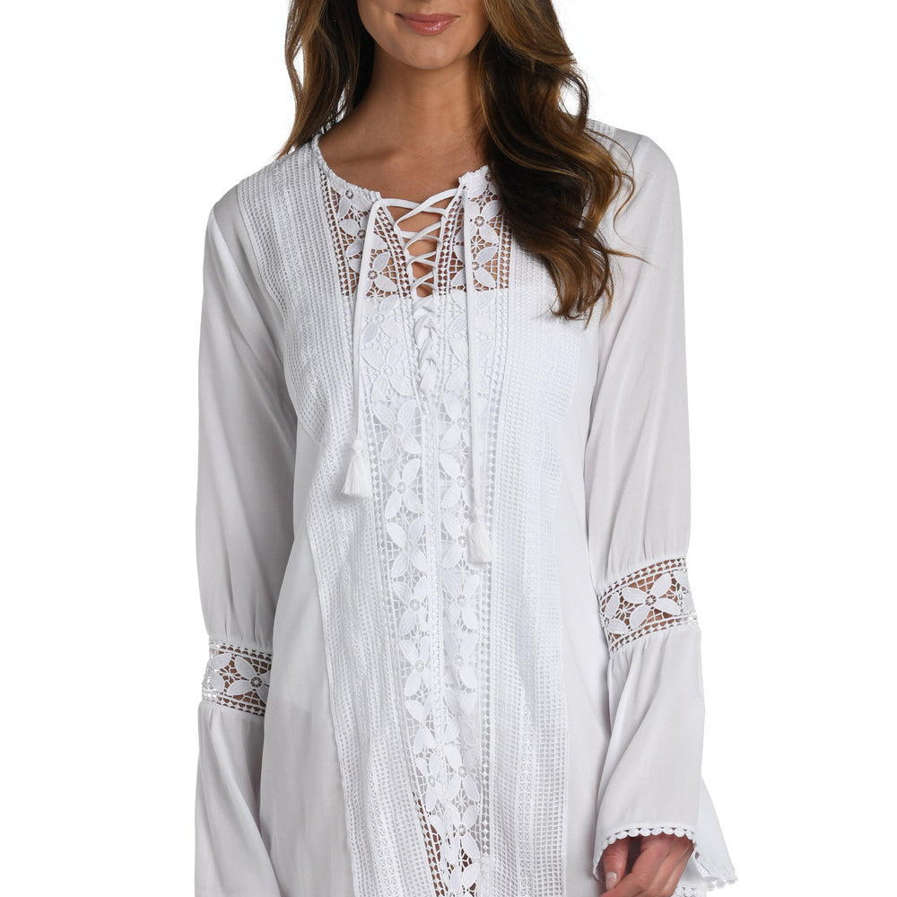 Model is wearing a crochet detailed pattern on this white v-neck tunic cover up from out Coastal Covers collection!