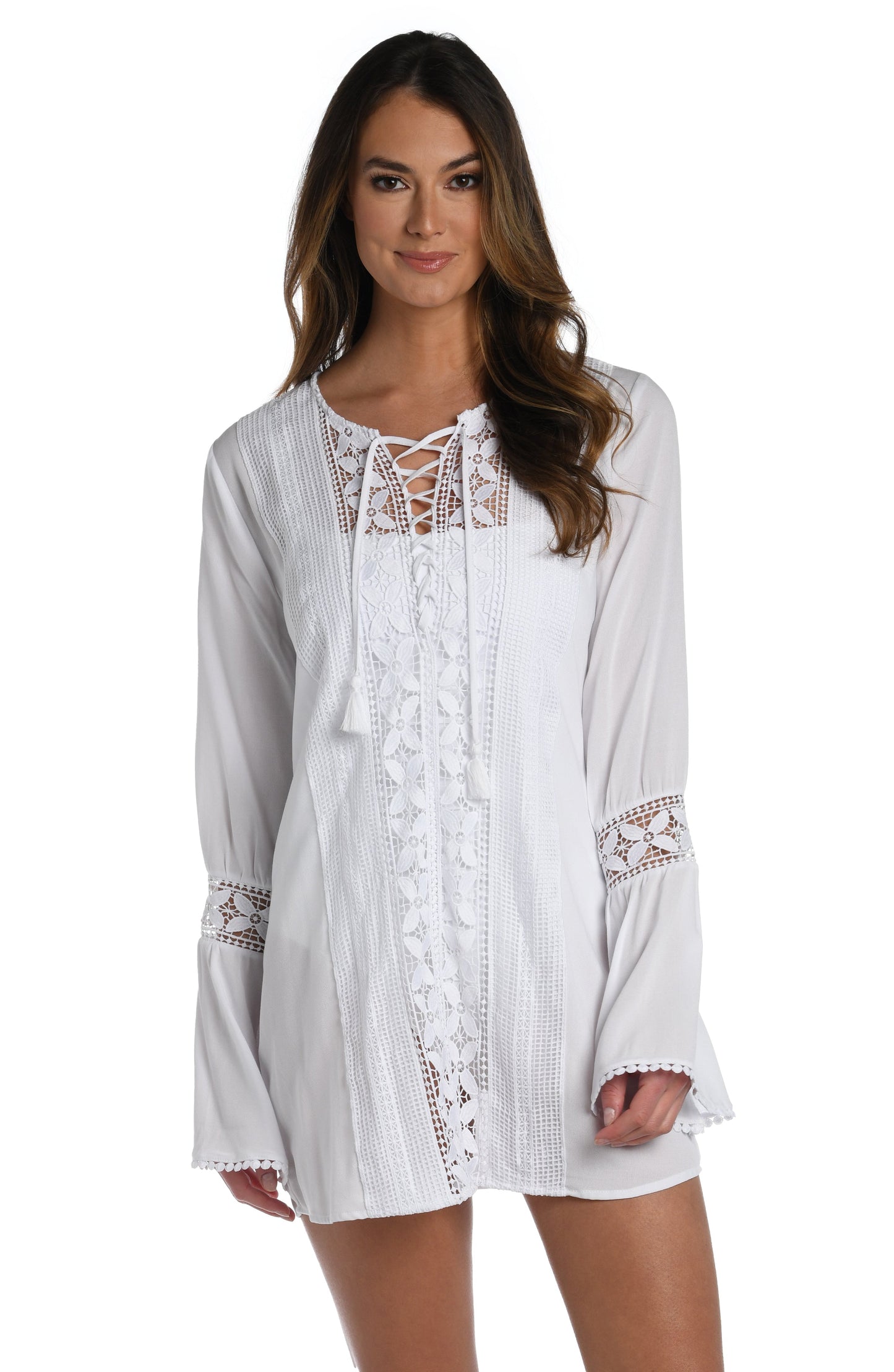 Model is wearing a crochet detailed pattern on this white v-neck tunic cover up from out Coastal Covers collection!