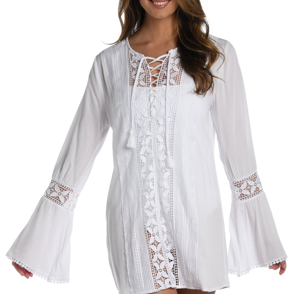 
                  
                    Model is wearing a crochet detailed pattern on this white v-neck tunic cover up from out Coastal Covers collection!
                  
                