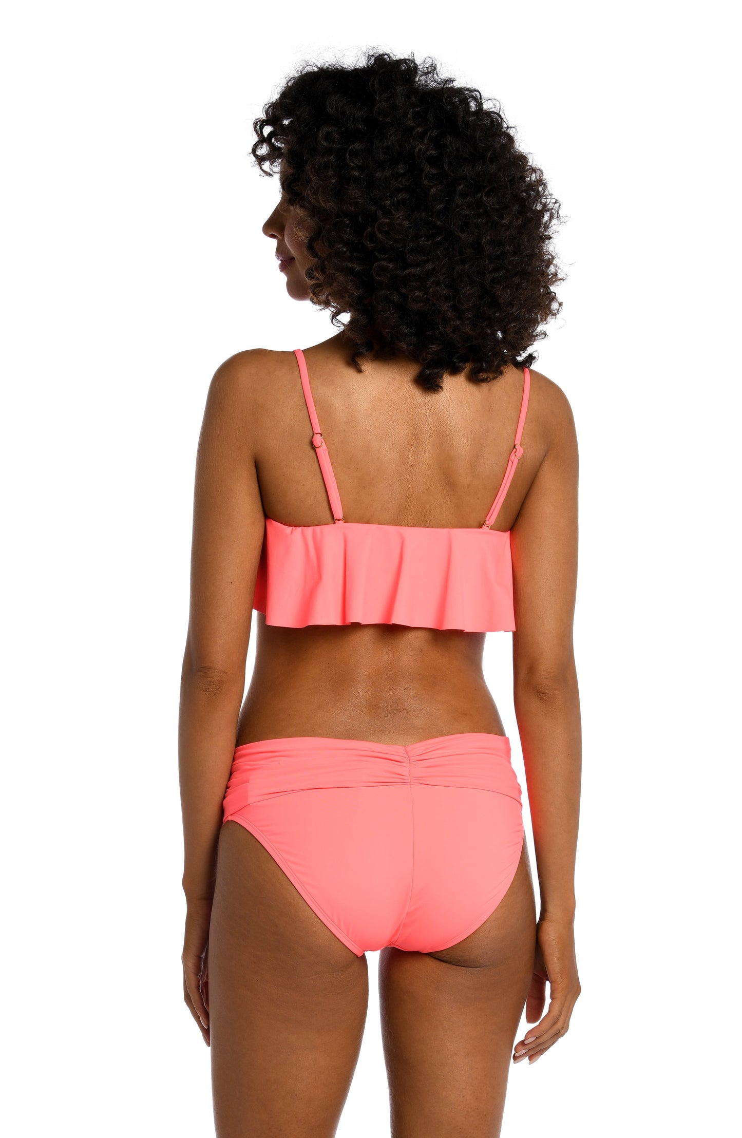 Model is wearing a hot coral colored ruffle bandeau swimsuit top from our Best-Selling Island Goddess collection.