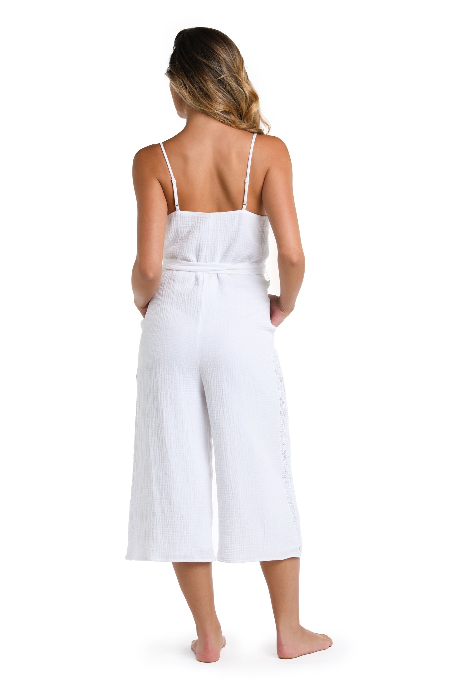 Model is wearing a solid white colored Wide Leg Jumpsuit Cover Up