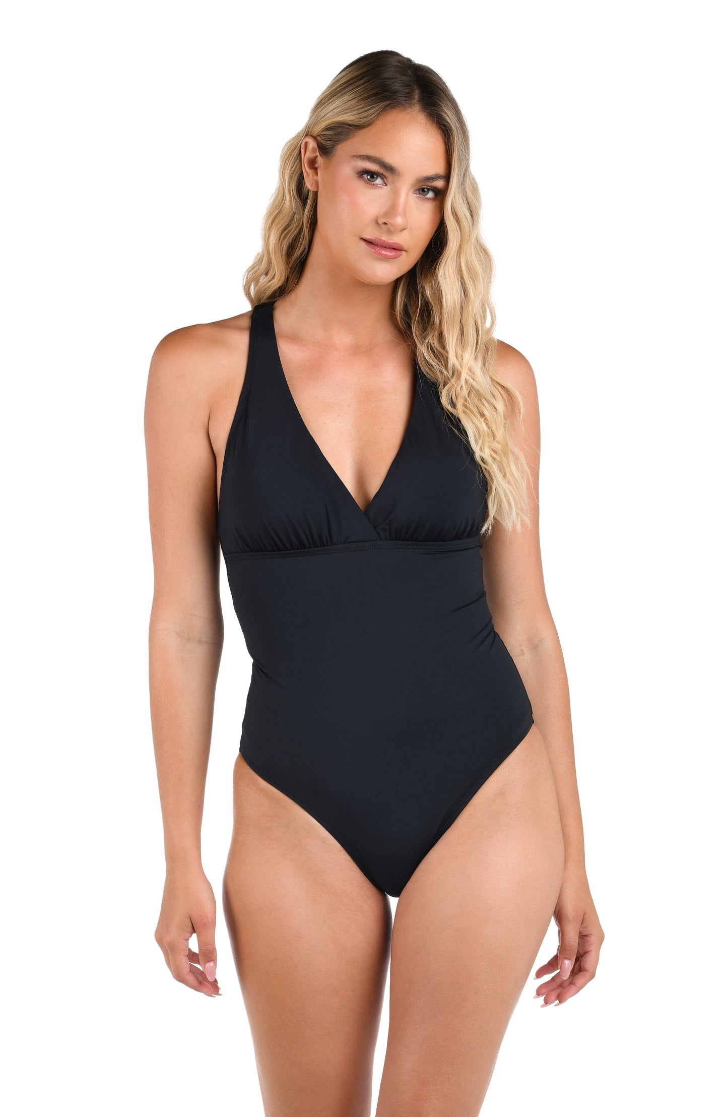 Model is wearing the Island Goddess Macrame Back One Piece in Black.