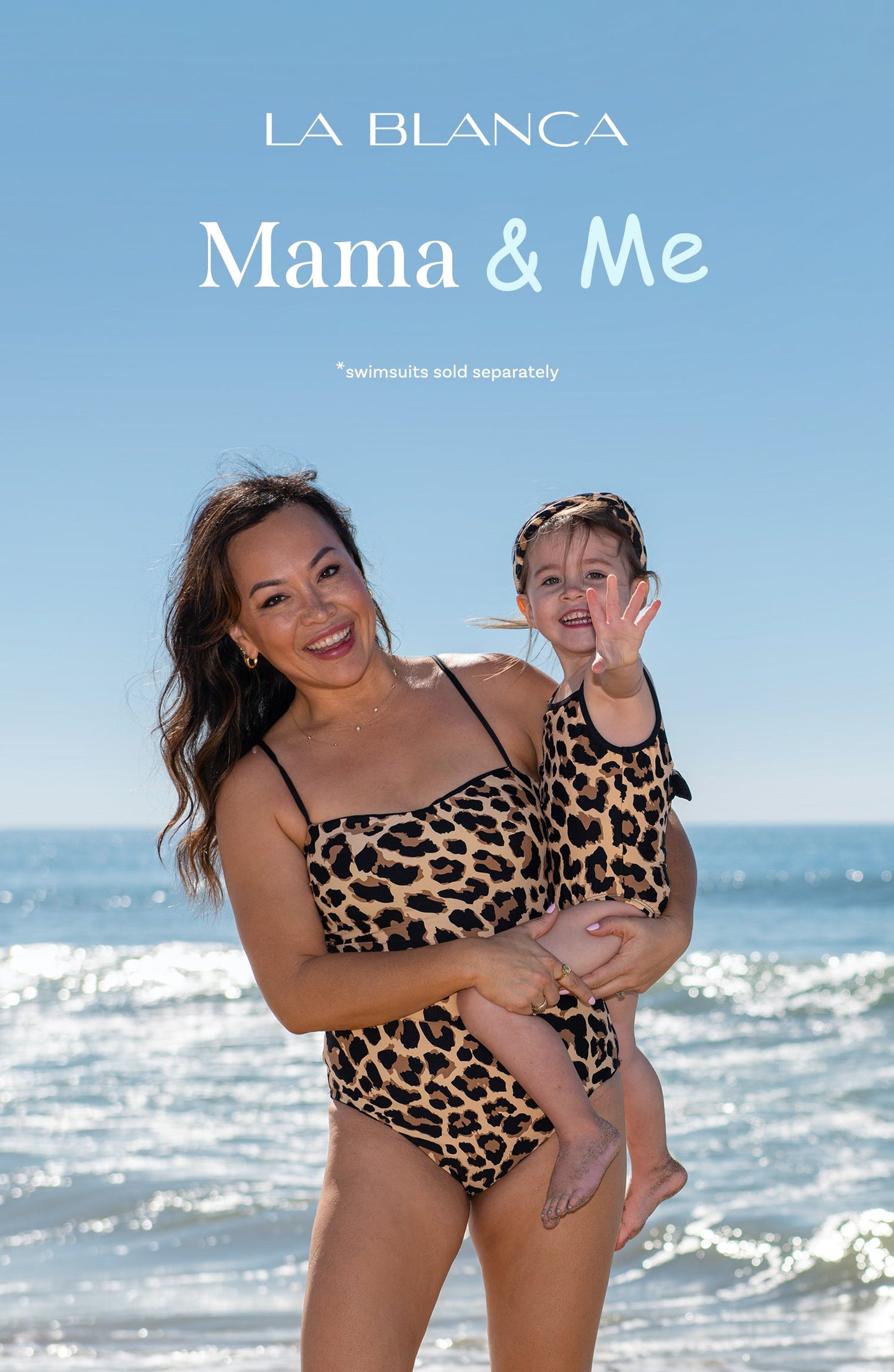 Toddler is wearing a black and tan leopard printed high neck one piece from our Mama and Me Running Wild collection.