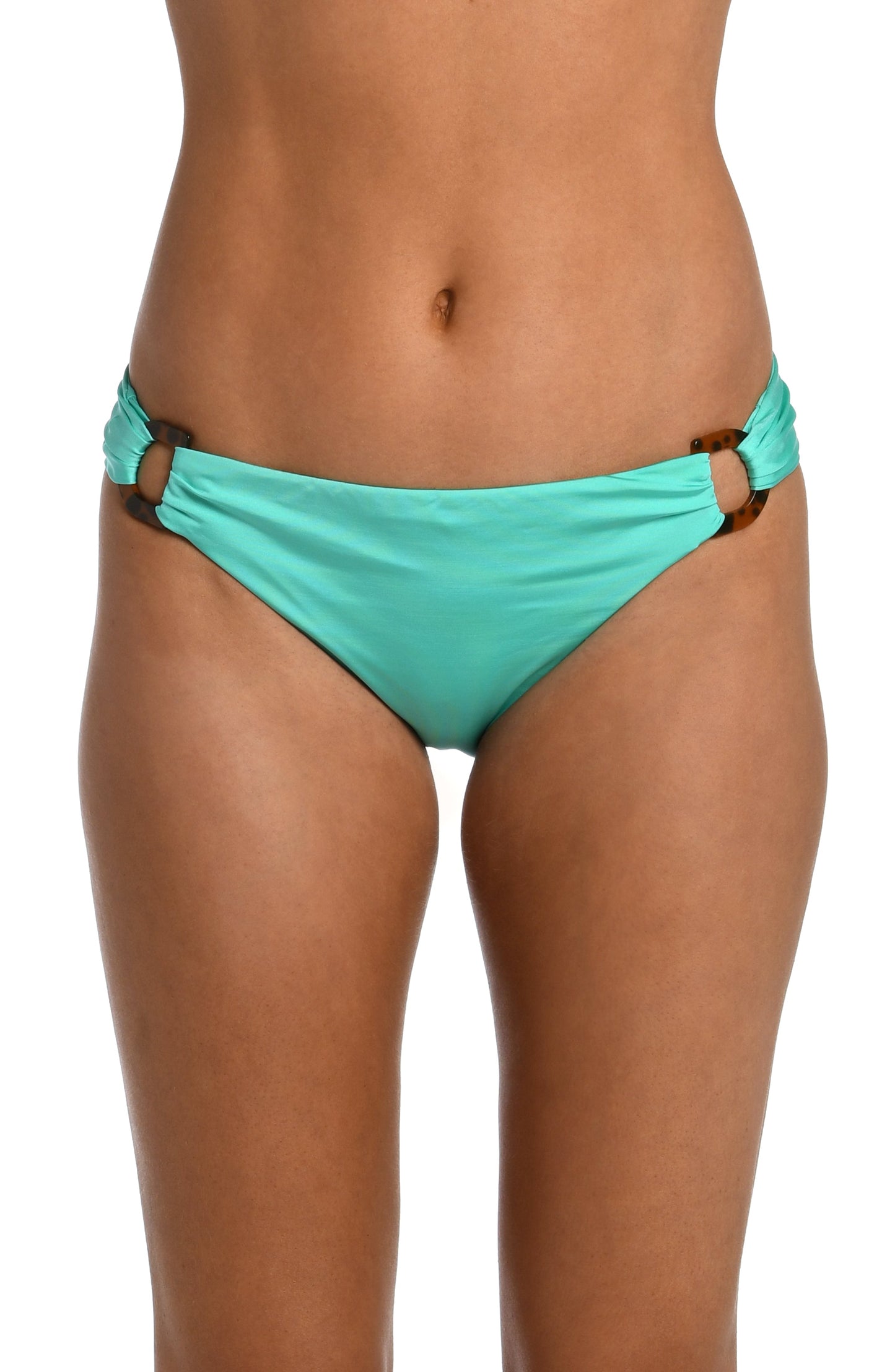 Model is wearing a solid seafoam green colored side tie hipster bikini bottom from our Wanderlust Solids collection.