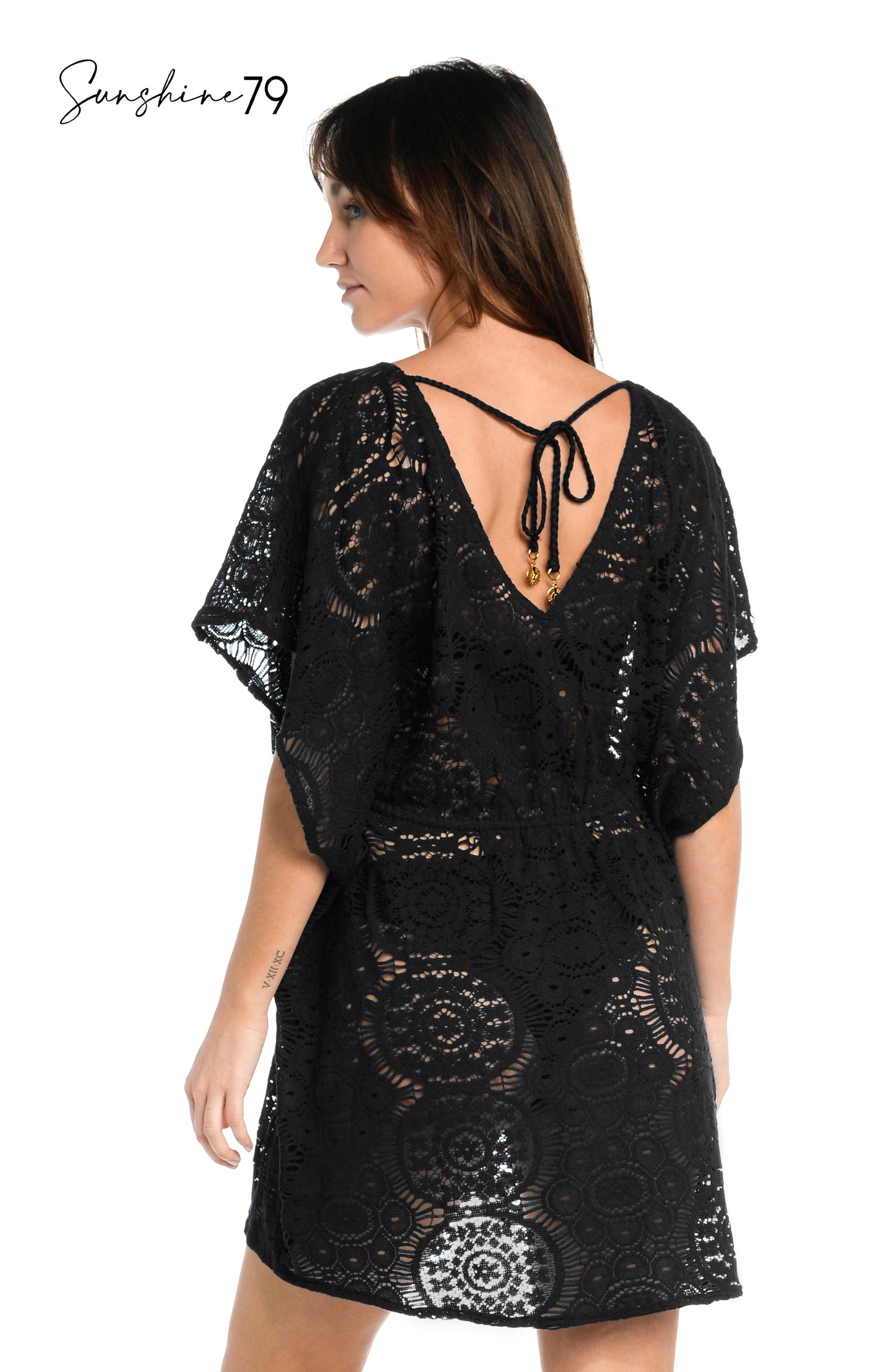 Model is wearing a black colored crochet tunic cover up from our Chillin Crochet collection!