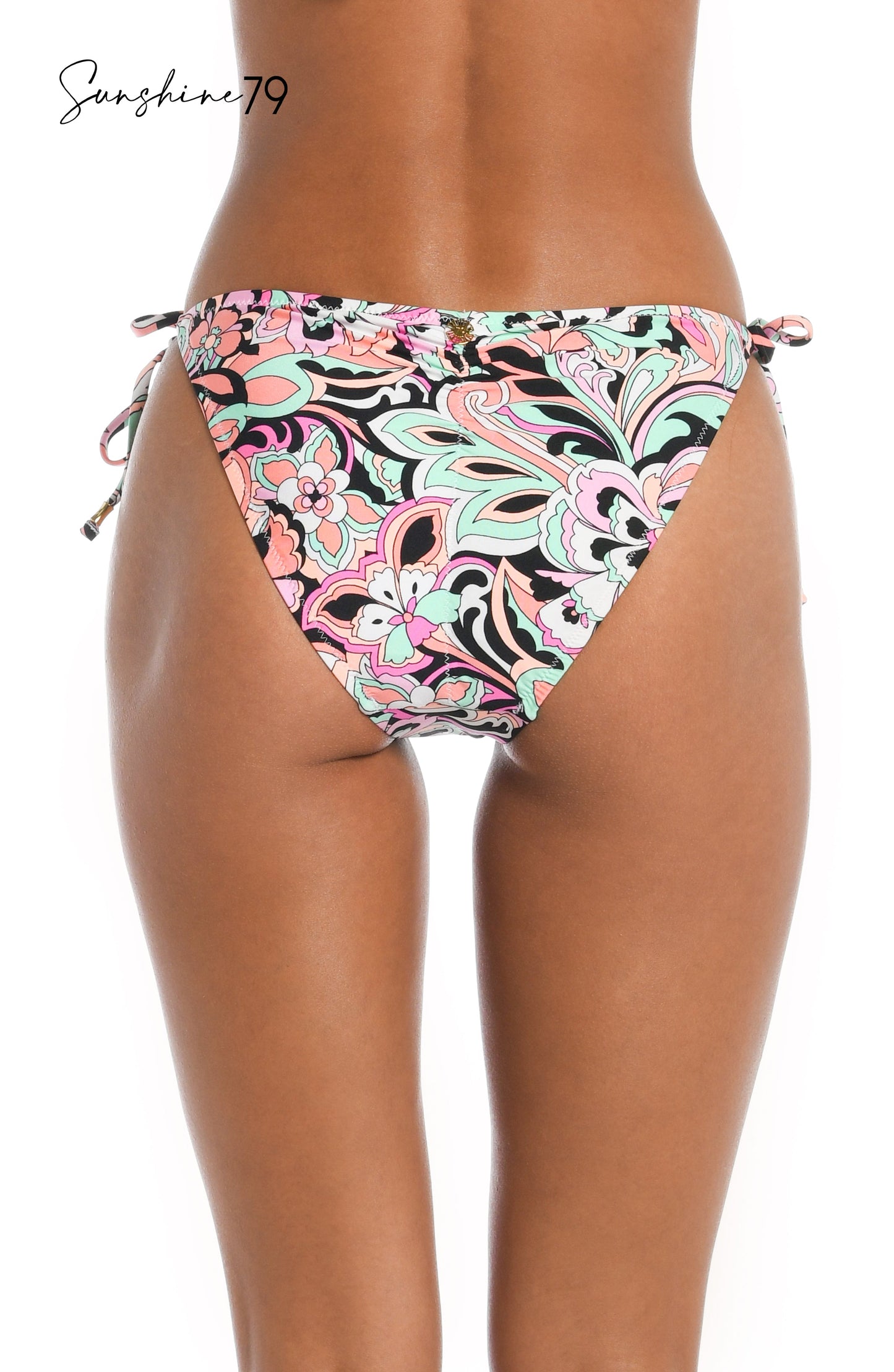 Model is wearing a pink multicolored paisley printed string tie side hipster bikini bottom from our Sunshine 79 brand.