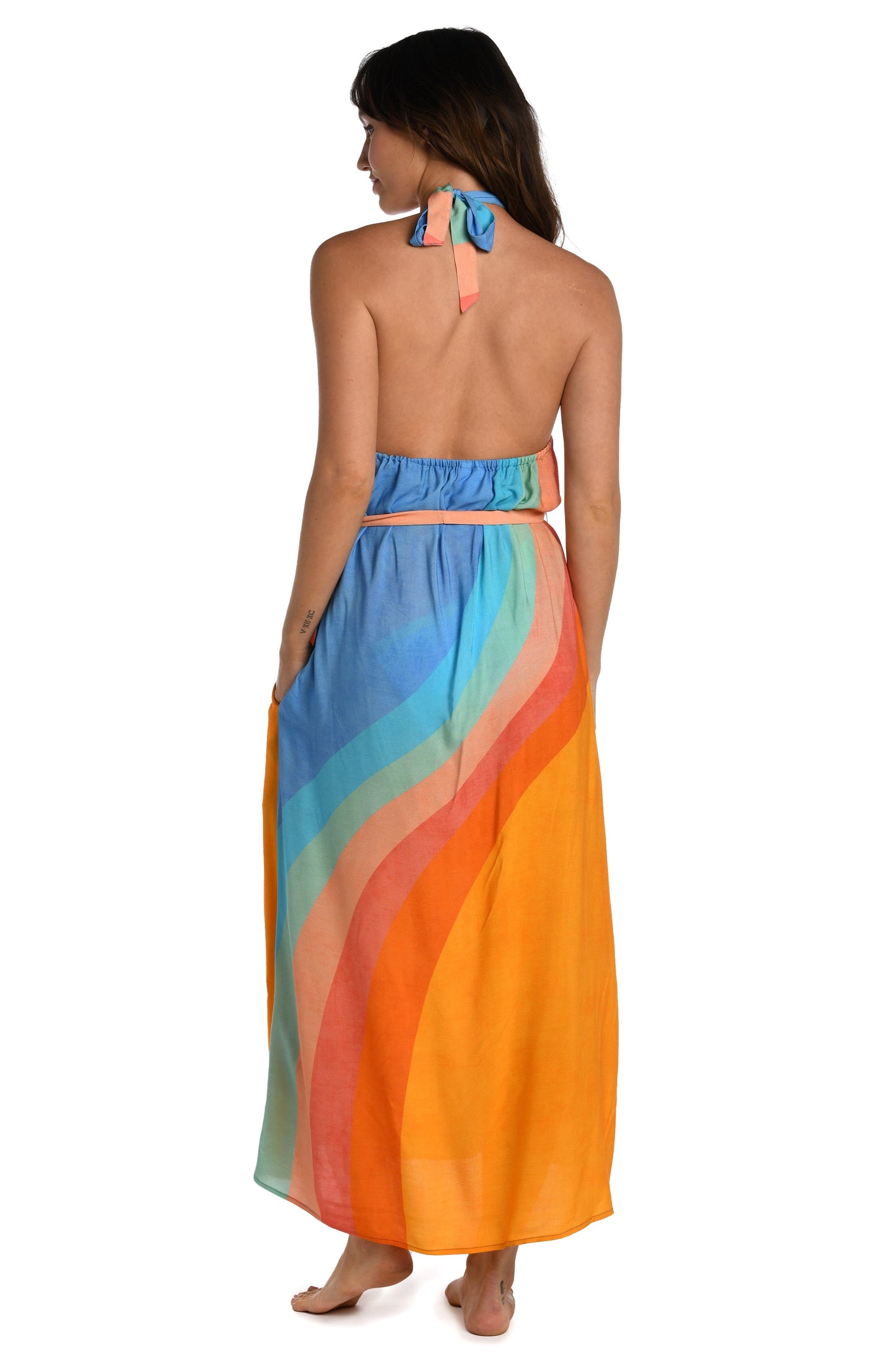 Model is wearing an orange and blue multicolored retro printed maxi dress cover up from our Mod Block collection.