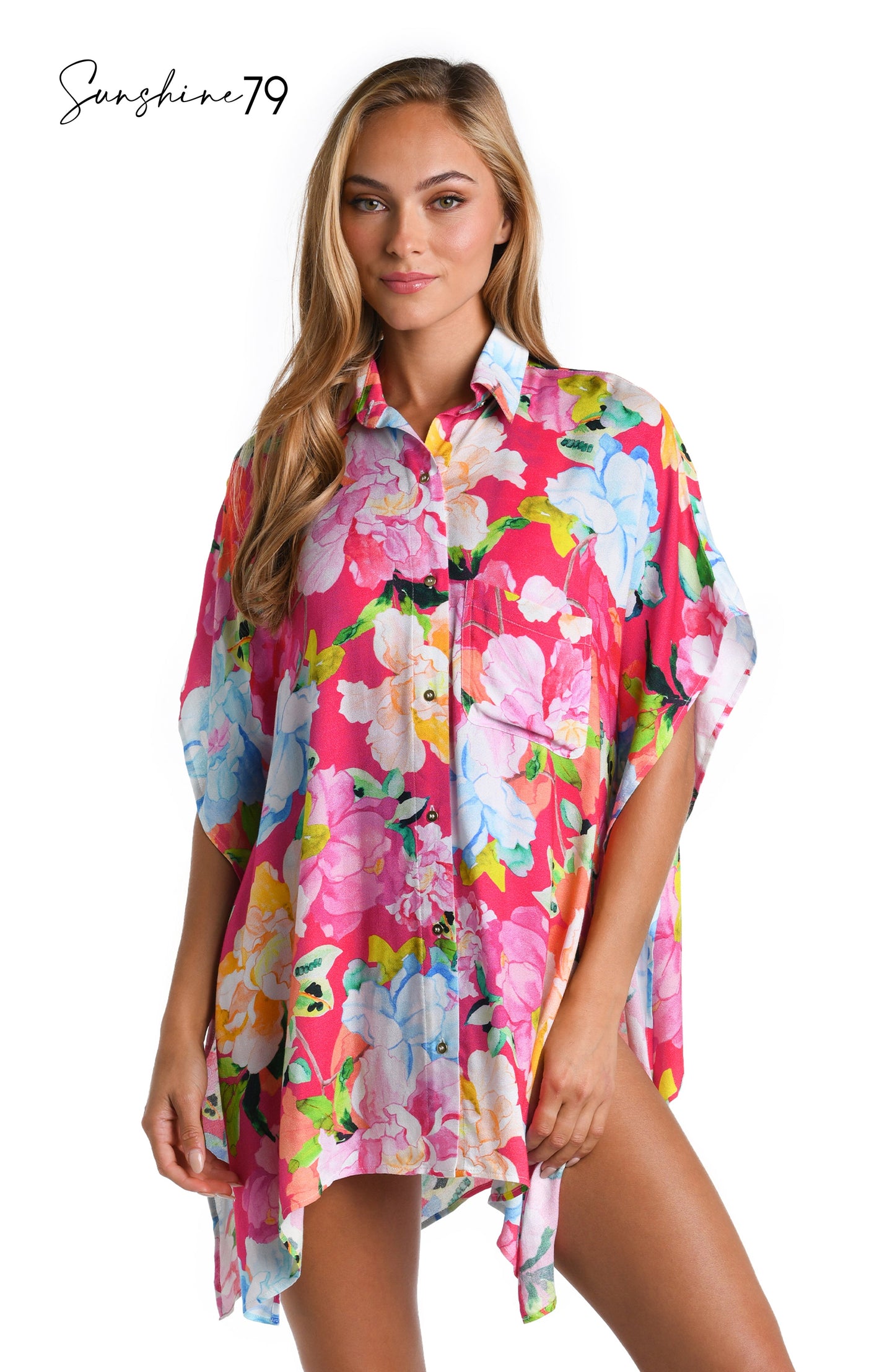 Model is wearing a colorful floral resort shirt cover up from the Sunshine 79 Expressive Garden Collection