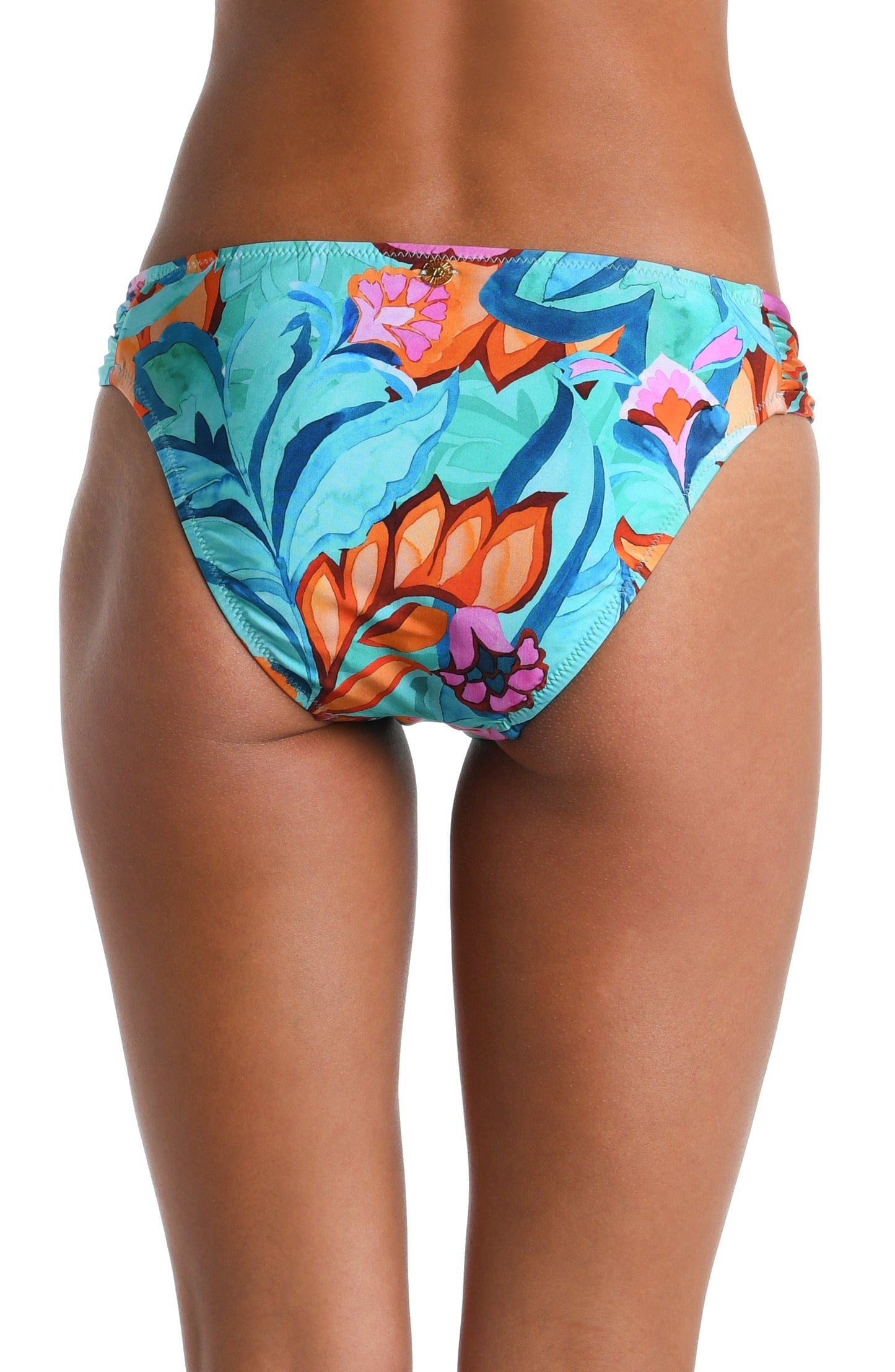 Model is wearing a turquoise, blue, coral multicolored floral printed Side Shirred Hipster Bottom